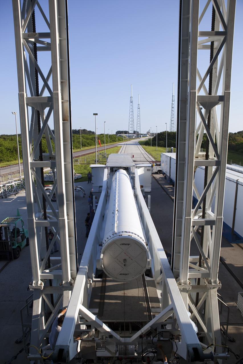 CAPE CANAVERAL, Fla. – With a view from an upper level at the Vertical Integration Facility at Space Launch Complex 41 on Cape Canaveral Air Force Station in Florida, a solid rocket motor (SRM) is being prepared for mating to a United Launch Alliance Atlas V rocket. The Atlas V will carry NASA's Mars Science Laboratory (MSL) mission into space.    MSL's components include a compact car-sized rover, Curiosity, which has 10 science instruments designed to search for evidence on whether Mars has had environments favorable to microbial life, including chemical ingredients for life.  The unique rover will use a laser to look inside rocks and release its gasses so that the rover’s spectrometer can analyze and send the data back to Earth. MSL is scheduled to launch Nov. 25 with a window extending to Dec. 18 and arrival at Mars Aug. 2012. For more information, visit http://www.nasa.gov/msl. Photo credit: NASA/Dimitri Gerondidakis