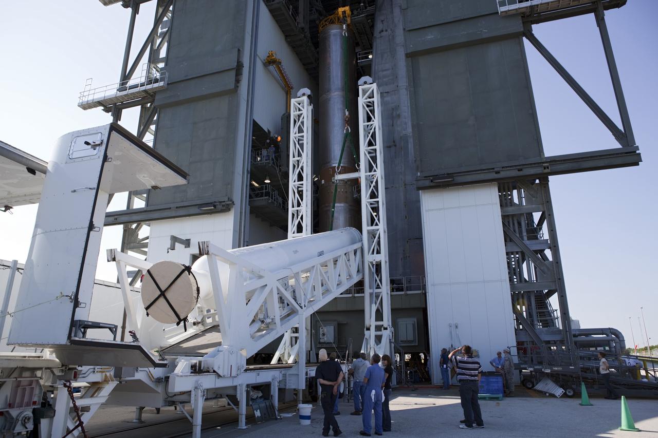 CAPE CANAVERAL, Fla. – At the Vertical Integration Facility at Space Launch Complex 41 on Cape Canaveral Air Force Station in Florida, technicians use a lifting device to elevate a solid rocket motor (SRM) into an upright position for mating to a United Launch Alliance Atlas V rocket. The Atlas V will carry NASA's Mars Science Laboratory (MSL) mission into space. MSL's components include a compact car-sized rover, Curiosity, which has 10 science instruments designed to search for evidence on whether Mars has had environments favorable to microbial life, including chemical ingredients for life. The unique rover will use a laser to look inside rocks and release its gasses so that the rover’s spectrometer can analyze and send the data back to Earth. MSL is scheduled to launch Nov. 25 with a window extending to Dec. 18 and arrival at Mars Aug. 2012. For more information, visit http://www.nasa.gov/msl. Photo credit: NASA/Dimitri Gerondidakis