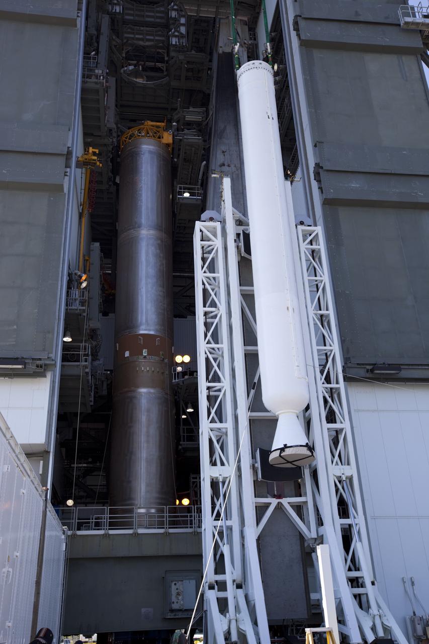 CAPE CANAVERAL, Fla. – At the Vertical Integration Facility at Space Launch Complex 41 on Cape Canaveral Air Force Station in Florida, a solid rocket motor (SRM) hangs in an upright position for mating to a United Launch Alliance Atlas V rocket which will carry NASA's Mars Science Laboratory (MSL) mission. MSL's components include a compact car-sized rover, Curiosity, which has 10 science instruments designed to search for evidence on whether Mars has had environments favorable to microbial life, including chemical ingredients for life. The unique rover will use a laser to look inside rocks and release its gasses so that the rover’s spectrometer can analyze and send the data back to Earth. MSL is scheduled to launch Nov. 25 with a window extending to Dec. 18 and arrival at Mars Aug. 2012. For more information, visit http://www.nasa.gov/msl. Photo credit: NASA/Dimitri Gerondidakis