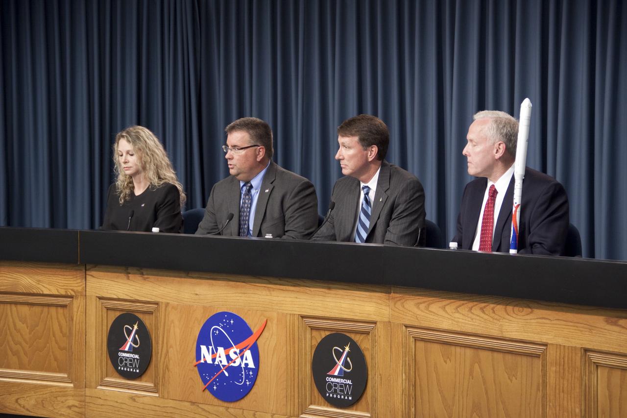 CAPE CANAVERAL, Fla. -- NASA and Alliant Techsystems (ATK) managers announce an agreement that could accelerate the availability of U.S. commercial crew transportation capabilities in the Press Site auditorium at NASA's Kennedy Space Center in Florida. From left are Candrea Thomas, NASA Public Affairs; Ed Mango, Commercial Crew Program manager, NASA; Kent Rominger, vice president, Strategy and Business Development, ATK Aerospace; and John Schumacher, vice president, Space Programs, EADS North America. The unfunded Space Act Agreement (SAA) through NASA's Commercial Crew Program will allow the agency and ATK to review and discuss Liberty system requirements, safety and certification plans, computational models of rocket stage performance, and avionics architecture designs. The agreement outlines key milestones including an Initial System Design review, during which ATK will present to NASA officials the Liberty systems level requirements, preliminary design, and certification process development. For more information about NASA's Commercial Crew Program, visit http://www.nasa.gov/exploration/commercial. Photo credit: NASA/Jim Grossmann
