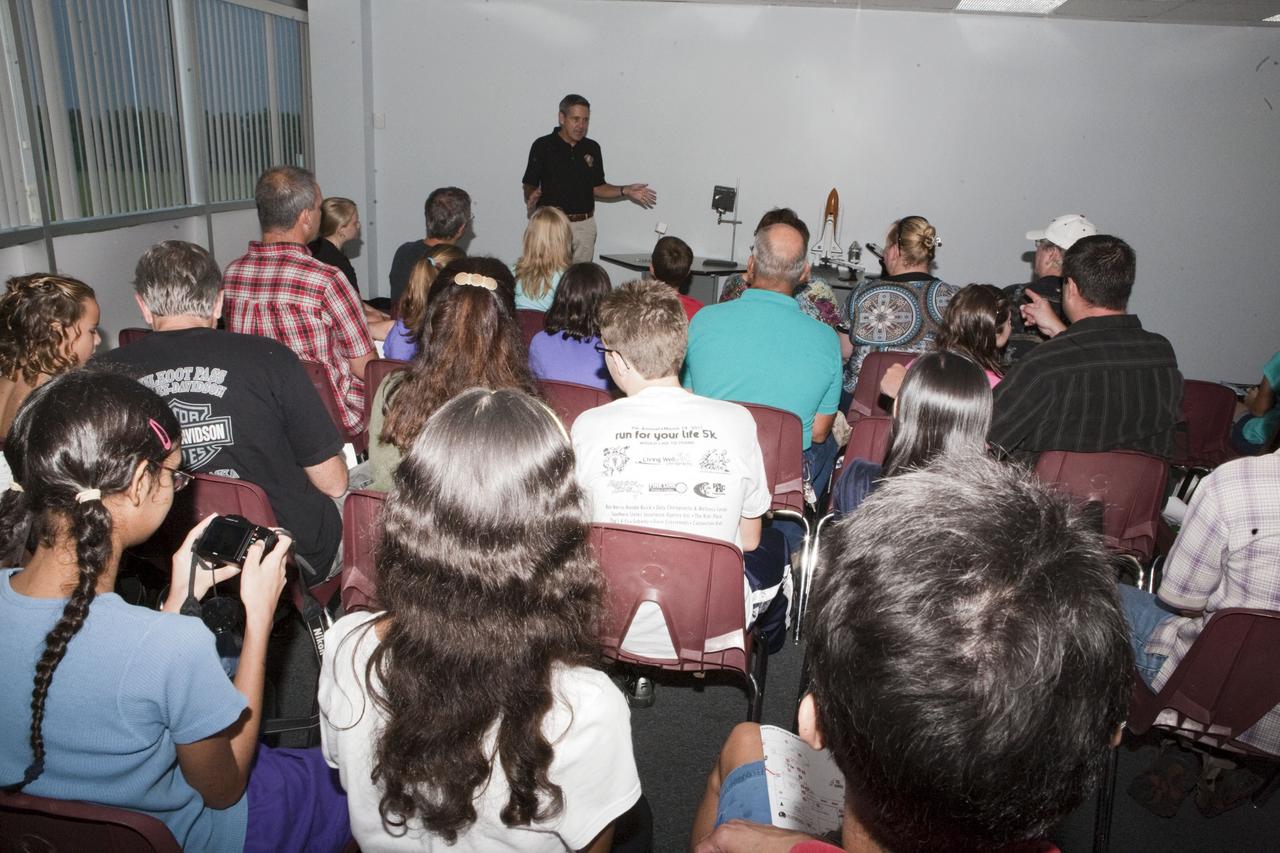 CAPE CANAVERAL, Fla. – Kennedy Space Center Director Bob Cabana speaks to children and their parents during Family Night, Sept. 10, at the U.S. Astronaut Hall of Fame in Florida.    NASA and the Kennedy Space Center Visitor Complex hosted the annual NASA family education night. The event, for fifth- through eighth-grade students and their parents, focuses on science, technology, engineering and mathematics (STEM) education activities that included astronaut appearances, a hovercraft, vortex cannon and alternative fuel vehicles. The back-to-school event is part of NASA’s Summer of Innovation initiative to provide interactive learning experiences to middle school students nationwide.  Photo credit: NASA/Amanda Diller