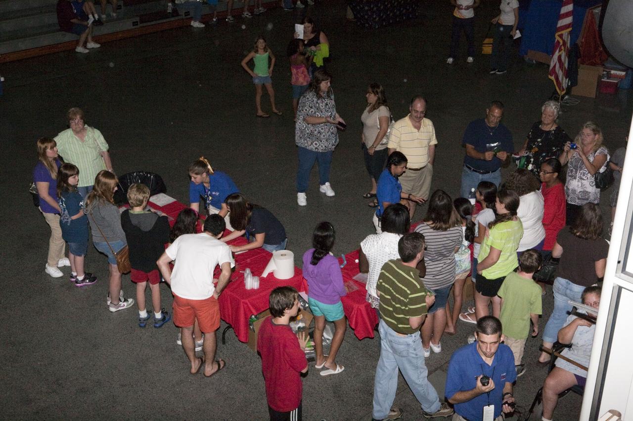 CAPE CANAVERAL, Fla. – Families sign up for activities at Kennedy Space Center’s Family Night, Sept. 10, at the U.S. Astronaut Hall of Fame in Florida.    NASA and the Kennedy Space Center Visitor Complex hosted the annual NASA family education night. The event, for fifth- through eighth-grade students and their parents, focuses on science, technology, engineering and mathematics (STEM) education activities that included astronaut appearances, a hovercraft, vortex cannon and alternative fuel vehicles. The back-to-school event is part of NASA’s Summer of Innovation initiative to provide interactive learning experiences to middle school students nationwide.  Photo credit: NASA/Amanda Diller