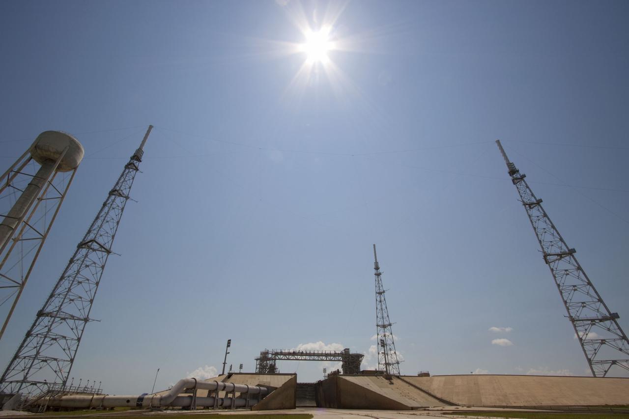 CAPE CANAVERAL, Fla. – The deconstruction of Launch Pad 39B at NASA’s Kennedy Space Center in Florida is complete. Still remaining and standing over the remnants of the fixed service structure are the 600-foot-tall lightning protection towers and the water tower used for sound suppression. In 2009, the structure at the pad was no longer needed for NASA's Space Shuttle Program, so it is being restructured for future use. The new design will feature a "clean pad" for rockets to come with their own launcher, making it more versatile for a number of vehicles. For information on NASA's future plans, visit http://www.nasa.gov/exploration. Photo credit: NASA/Jim Grossmann