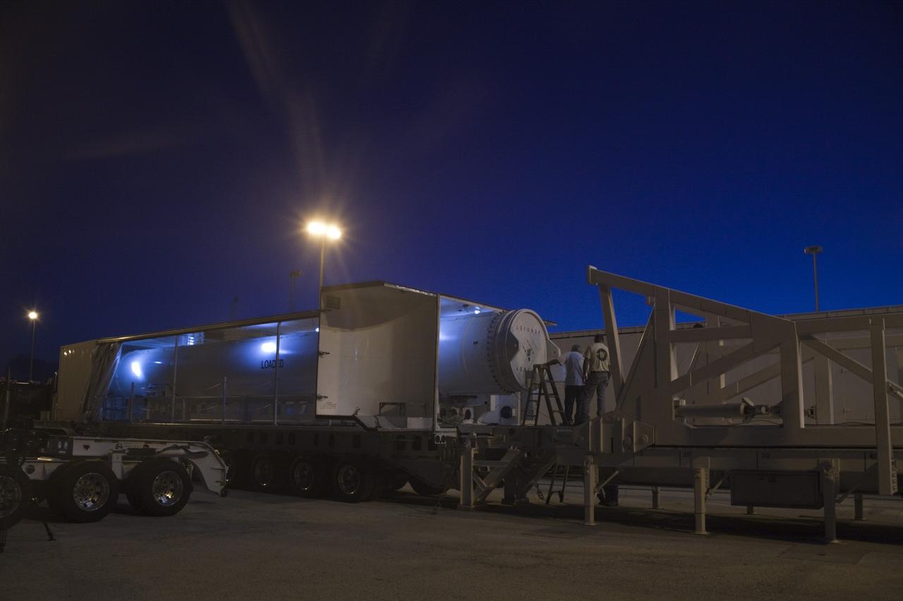 CAPE CANAVERAL, Fla. – Under the night sky at Space Launch Complex 41 on Cape Canaveral Air Force Station in Florida, workers prepare the final solid rocket motor (SRM) for lifting into the Vertical Integration Facility. The SRM will be mated to a United Launch Alliance Atlas V rocket being prepared to launch NASA's Mars Science Laboratory (MSL) mission. MSL's components include a compact car-sized rover, Curiosity, which has 10 science instruments designed to search for evidence on whether Mars has had environments favorable to microbial life, including chemical ingredients for life. The unique rover will use a laser to look inside rocks and release its gasses so that the rover’s spectrometer can analyze and send the data back to Earth. MSL is scheduled to launch Nov. 25 with a window extending to Dec. 18 and arrival at Mars Aug. 2012. For more information, visit http://www.nasa.gov/msl. Photo credit: NASA/Jim Grossmann