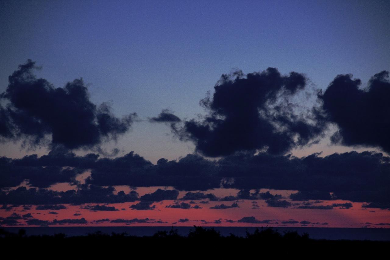 CAPE CANAVERAL, Fla. – As daylight breaks on Florida’s space coast, preparations are underway for mating of the final solid rocket motor (SRM) to a United Launch Alliance Atlas V rocket at the Vertical Integration Facility at Space Launch Complex 41 on Cape Canaveral Air Force Station. The Atlas V will carry NASA's Mars Science Laboratory (MSL) mission into space. MSL's components include a compact car-sized rover, Curiosity, which has 10 science instruments designed to search for evidence on whether Mars has had environments favorable to microbial life, including chemical ingredients for life. The unique rover will use a laser to look inside rocks and release its gasses so that the rover’s spectrometer can analyze and send the data back to Earth. MSL is scheduled to launch Nov. 25 with a window extending to Dec. 18 and arrival at Mars Aug. 2012. For more information, visit http://www.nasa.gov/msl. Photo credit: NASA/Jim Grossmann