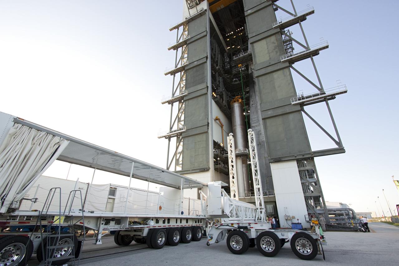CAPE CANAVERAL, Fla. – At the Vertical Integration Facility at Space Launch Complex 41 on Cape Canaveral Air Force Station in Florida, technicians guide the final solid rocket motor (SRM) off a trailer. The motor will be mated to a United Launch Alliance Atlas V rocket which will carry NASA's Mars Science Laboratory (MSL) mission. MSL's components include a compact car-sized rover, Curiosity, which has 10 science instruments designed to search for evidence on whether Mars has had environments favorable to microbial life, including chemical ingredients for life. The unique rover will use a laser to look inside rocks and release its gasses so that the rover’s spectrometer can analyze and send the data back to Earth. MSL is scheduled to launch Nov. 25 with a window extending to Dec. 18 and arrival at Mars Aug. 2012. For more information, visit http://www.nasa.gov/msl. Photo credit: NASA/Jim Grossmann