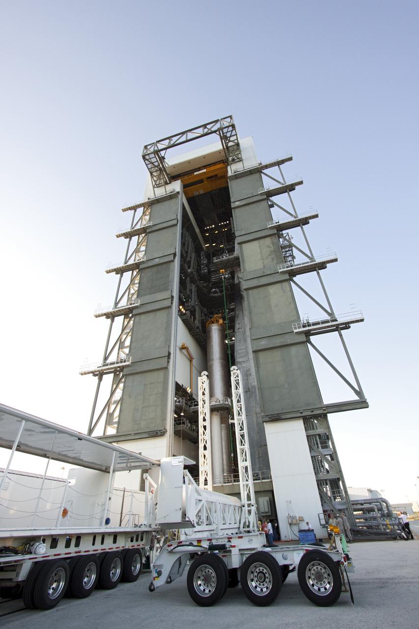 CAPE CANAVERAL, Fla. – At the Vertical Integration Facility at Space Launch Complex 41 on Cape Canaveral Air Force Station in Florida, technicians guide the final solid rocket motor (SRM) off a trailer. The motor will be mated to a United Launch Alliance Atlas V rocket which will carry NASA's Mars Science Laboratory (MSL) mission.     MSL's components include a compact car-sized rover, Curiosity, which has 10 science instruments designed to search for evidence on whether Mars has had environments favorable to microbial life, including chemical ingredients for life.  The unique rover will use a laser to look inside rocks and release its gasses so that the rover’s spectrometer can analyze and send the data back to Earth. MSL is scheduled to launch Nov. 25 with a window extending to Dec. 18 and arrival at Mars Aug. 2012. For more information, visit http://www.nasa.gov/msl. Photo credit: NASA/Jim Grossmann