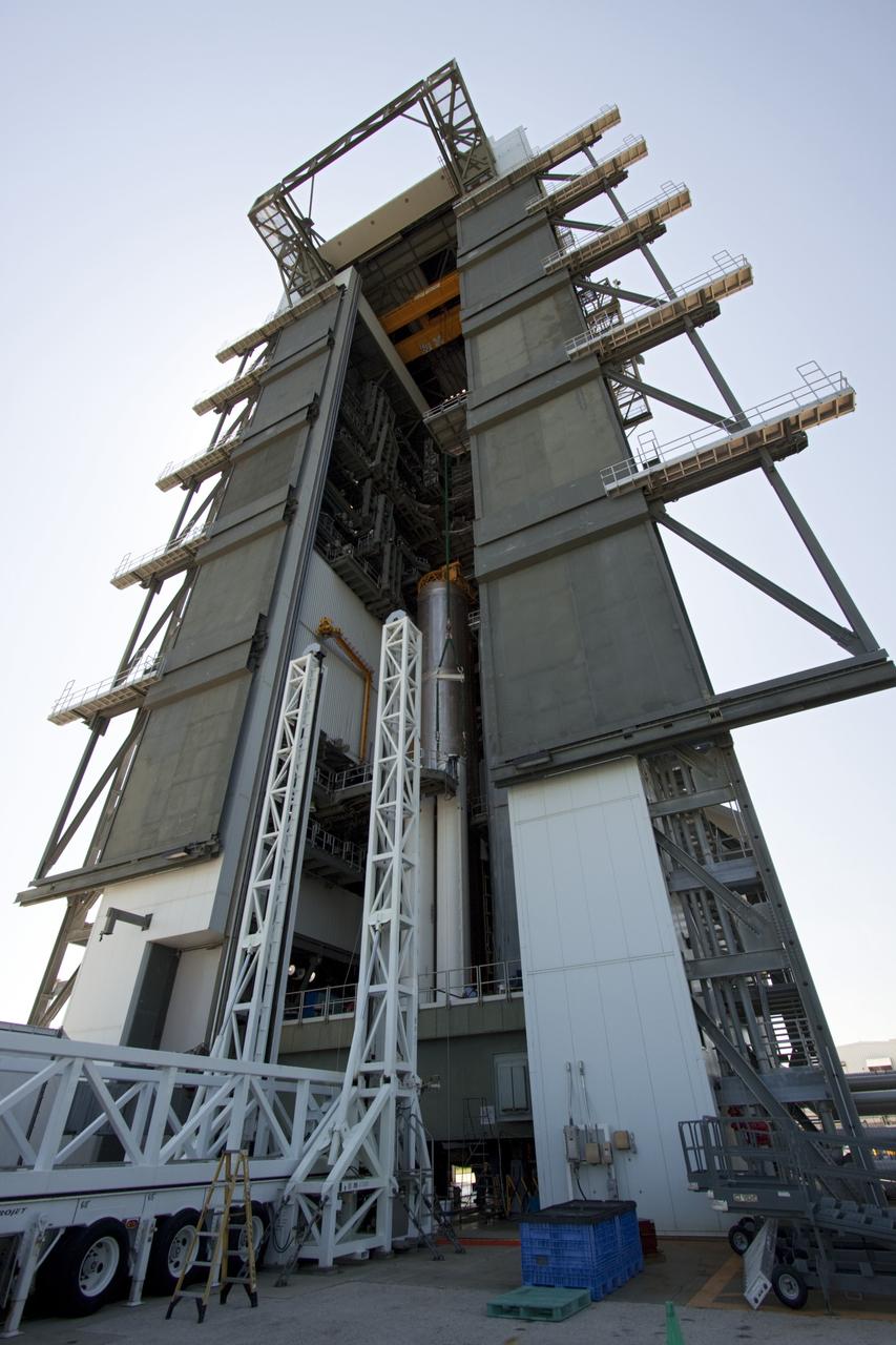 CAPE CANAVERAL, Fla. – At the Vertical Integration Facility at Space Launch Complex 41 on Cape Canaveral Air Force Station in Florida, the final solid rocket motor (SRM) is ready for mating to the first stage of a United Launch Alliance Atlas V rocket. The Atlas V will carry NASA's Mars Science Laboratory (MSL) mission into space. MSL's components include a compact car-sized rover, Curiosity, which has 10 science instruments designed to search for evidence on whether Mars has had environments favorable to microbial life, including chemical ingredients for life. The unique rover will use a laser to look inside rocks and release its gasses so that the rover’s spectrometer can analyze and send the data back to Earth. MSL is scheduled to launch Nov. 25 with a window extending to Dec. 18 and arrival at Mars Aug. 2012. For more information, visit http://www.nasa.gov/msl. Photo credit: NASA/Jim Grossmann