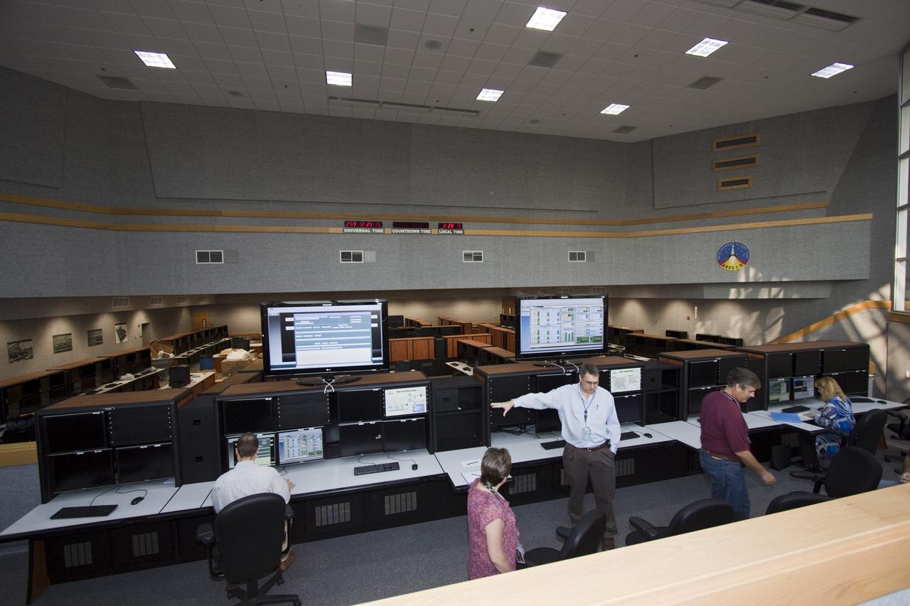 CAPE CANAVERAL, Fla. – At the newly remodeled Launch Control Center's Young-Crippen Firing Room at NASA's Kennedy Space Center in Florida, engineering directorate personnel demonstrate the recently added Space Command & Control System which will be used for launches of future human spaceflight vehicles.    Known as Firing Room 1 in the Apollo era, it was re-named as a tribute to the Space Shuttle Program's first crewed mission, STS-1, which was flown by Commander John W. Young and Pilot Robert L. Crippen in April 1981. Photo credit: NASA/Jim Grossmann
