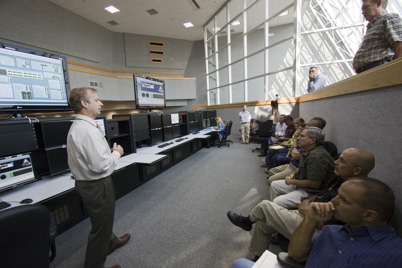 CAPE CANAVERAL, Fla. – At the newly remodeled Launch Control Center's Young-Crippen Firing Room at NASA's Kennedy Space Center in Florida, engineering directorate personnel demonstrate the recently added Space Command & Control System which will be used for launches of future human spaceflight vehicles.    Known as Firing Room 1 in the Apollo era, it was re-named as a tribute to the Space Shuttle Program's first crewed mission, STS-1, which was flown by Commander John W. Young and Pilot Robert L. Crippen in April 1981. Photo credit: NASA/Jim Grossmann