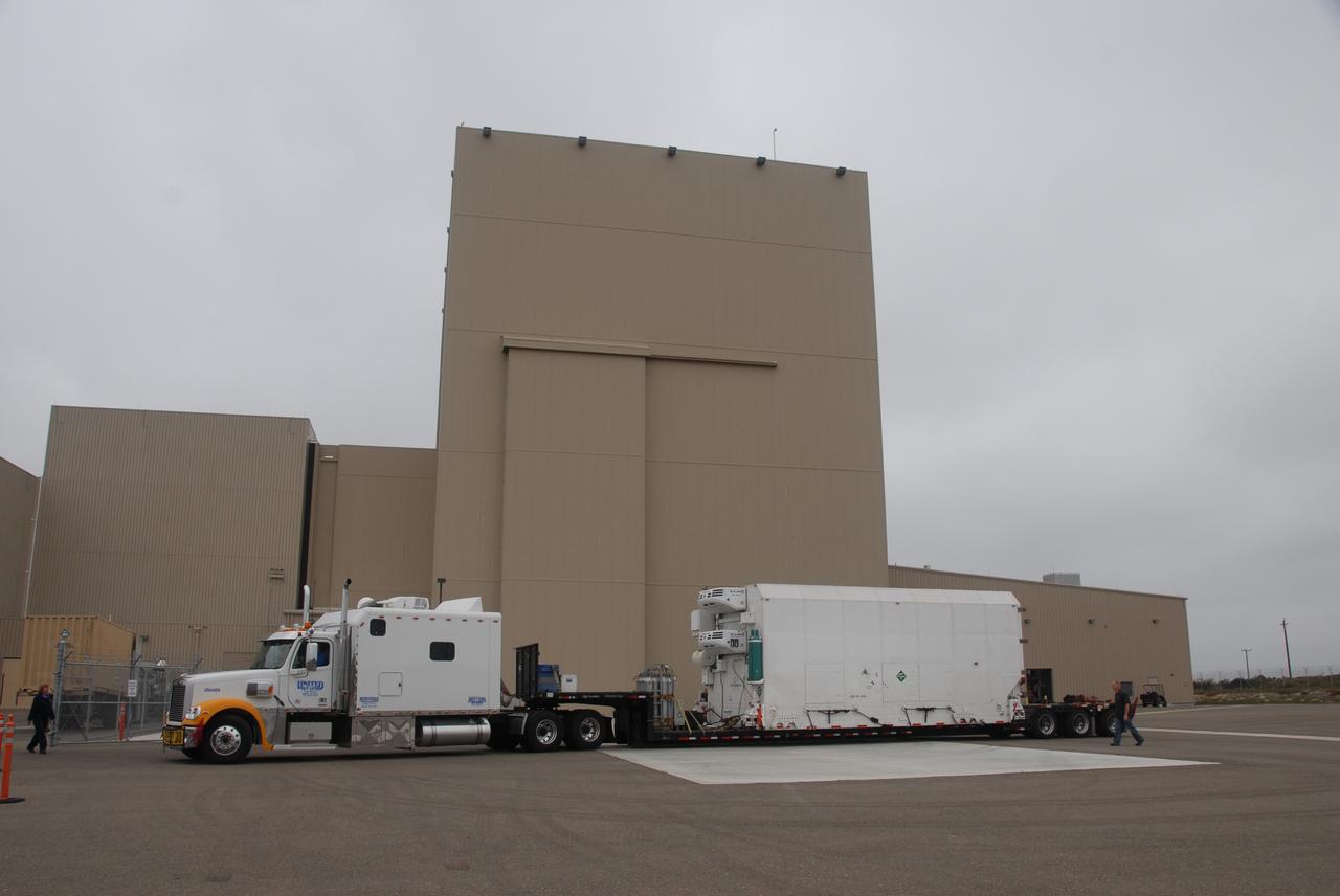 VANDENBERG AIR FORCE BASE, Calif. – Transported by truck, the environmentally controlled transportation container holding NASA’s National Polar-orbiting Operational Environmental Satellite System Preparatory Project (NPP) arrives at the Astrotech Payload Processing Facility at Vandenberg Air Force Base in California.     NPP represents a critical first step in building the next-generation of Earth-observing satellites. NPP will carry the first of the new sensors developed for this satellite fleet, now known as the Joint Polar Satellite System (JPSS), to be launched in 2016. NPP is the bridge between NASA’s Earth Observing System (EOS) satellites and the forthcoming series of JPSS satellites. The mission will test key technologies and instruments for the JPSS missions. NPP is targeted to launch Oct. 25 from Space Launch Complex-2 aboard a United Launch Alliance Delta II rocket. For more information, visit http://www.nasa.gov/NPP. Photo credit: NASA/30th Communications Squadron, VAFB