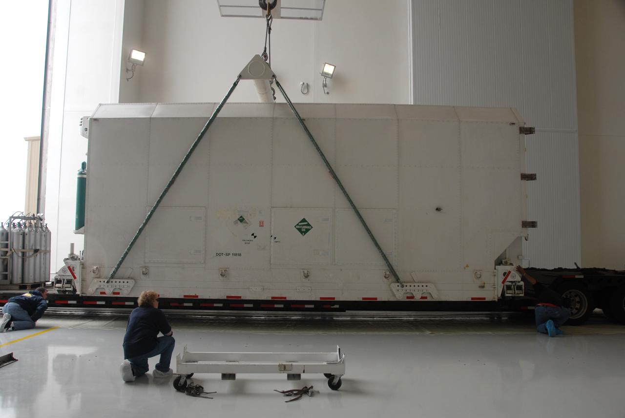 VANDENBERG AIR FORCE BASE, Calif. – In the Astrotech Payload Processing Facility at Vandenberg Air Force Base in California, technicians attach a crane to the container holding NASA’s National Polar-orbiting Operational Environmental Satellite System Preparatory Project (NPP). NPP represents a critical first step in building the next-generation of Earth-observing satellites. NPP will carry the first of the new sensors developed for this satellite fleet, now known as the Joint Polar Satellite System (JPSS), to be launched in 2016. NPP is the bridge between NASA’s Earth Observing System (EOS) satellites and the forthcoming series of JPSS satellites. The mission will test key technologies and instruments for the JPSS missions. NPP is targeted to launch Oct. 25 from Space Launch Complex-2 aboard a United Launch Alliance Delta II rocket. For more information, visit http://www.nasa.gov/NPP. Photo credit: NASA/30th Communications Squadron, VAFB
