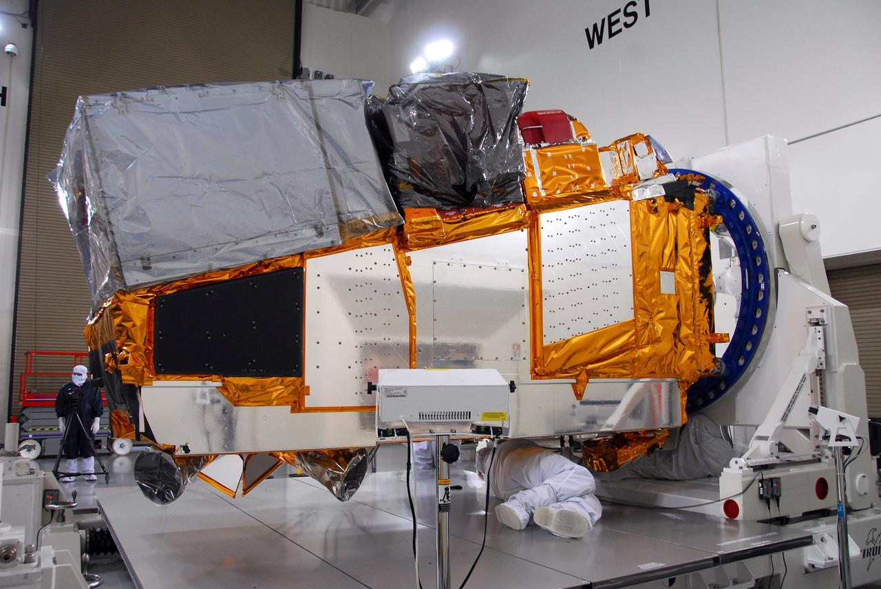 VANDENBERG AIR FORCE BASE, Calif. – In a clean room inside the Astrotech Payload Processing Facility at Vandenberg Air Force Base in California, technicians position NASA’s National Polar-orbiting Operational Environmental Satellite System Preparatory Project (NPP) for test and checkout. NPP represents a critical first step in building the next-generation of Earth-observing satellites. NPP will carry the first of the new sensors developed for this satellite fleet, now known as the Joint Polar Satellite System (JPSS), to be launched in 2016. NPP is the bridge between NASA’s Earth Observing System (EOS) satellites and the forthcoming series of JPSS satellites. The mission will test key technologies and instruments for the JPSS missions. NPP is targeted to launch Oct. 25 from Space Launch Complex-2 aboard a United Launch Alliance Delta II rocket. For more information, visit http://www.nasa.gov/NPP. Photo credit: NASA/30th Communications Squadron, VAFB