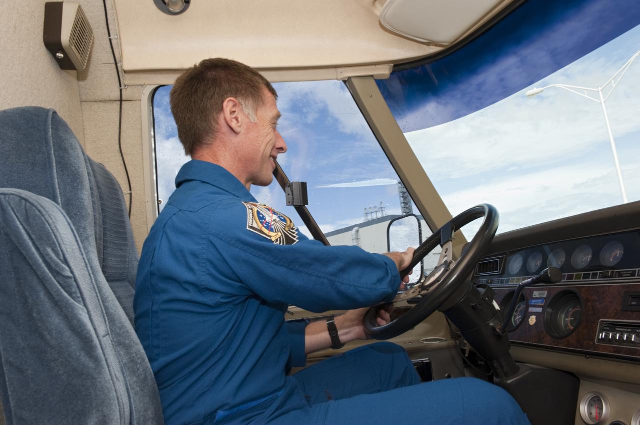 CAPE CANAVERAL, Fla. – STS-135 Commander Chris Ferguson settles in the driver's seat of NASA’s silver Astrovan. Since 1984, the Astrovan, a modified Airstream motor home, has carried shuttle crew members to the launch pads. Ferguson, along with Pilot Doug Hurley and Mission Specialist Sandra Magnus, was at the center for the traditional post-flight crew return presentation.     STS-135 Mission Specialist Rex Walheim was unable to attend the Kennedy event. In July 2011, Atlantis and its crew delivered to the International Space Station the Raffaello multi-purpose logistics module packed with more than 9,400 pounds of spare parts, equipment and supplies that will sustain station operations for the next year. STS-135 was the 33rd and final flight for Atlantis and the final mission of the Space Shuttle Program. For more information, visit www.nasa.gov/mission_pages/shuttle/shuttlemissions/sts135/index.html. Photo credit: NASA/Kim Shiflett
