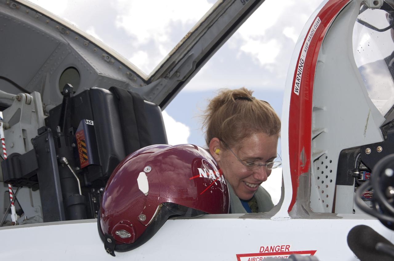 CAPE CANAVERAL, Fla. – At the Shuttle Landing Facility at NASA's Kennedy Space Center in Florida, STS-135 Mission Specialist Sandra Magnus prepares for departure in a T-38 training jet. Magnus, along with Commander Chris Ferguson and Pilot Doug Hurley, was at the center for the traditional post-flight crew return presentation. STS-135 Mission Specialist Rex Walheim was unable to attend the Kennedy event. In July 2011, Atlantis and its crew delivered to the International Space Station the Raffaello multi-purpose logistics module packed with more than 9,400 pounds of spare parts, equipment and supplies that will sustain station operations for the next year. STS-135 was the 33rd and final flight for Atlantis and the final mission of the Space Shuttle Program. For more information, visit www.nasa.gov/mission_pages/shuttle/shuttlemissions/sts135/index.html. Photo credit: NASA/Jim Grossmann