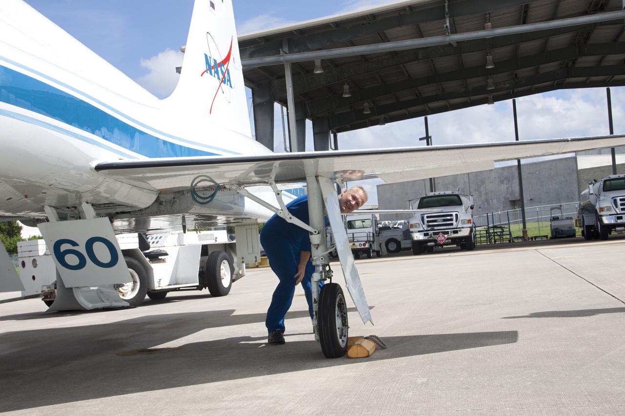 CAPE CANAVERAL, Fla. – At the Shuttle Landing Facility at NASA's Kennedy Space Center in Florida, STS-135 Pilot Doug Hurley inspects the wings on a T-38 training jet. Hurley, along with Commander Chris Ferguson and Mission Specialist Sandra Magnus, was at the center for the traditional post-flight crew return presentation. STS-135 Mission Specialist Rex Walheim was unable to attend the Kennedy event. In July 2011, Atlantis and its crew delivered to the International Space Station the Raffaello multi-purpose logistics module packed with more than 9,400 pounds of spare parts, equipment and supplies that will sustain station operations for the next year. STS-135 was the 33rd and final flight for Atlantis and the final mission of the Space Shuttle Program. For more information, visit www.nasa.gov/mission_pages/shuttle/shuttlemissions/sts135/index.html. Photo credit: NASA/Jim Grossmann