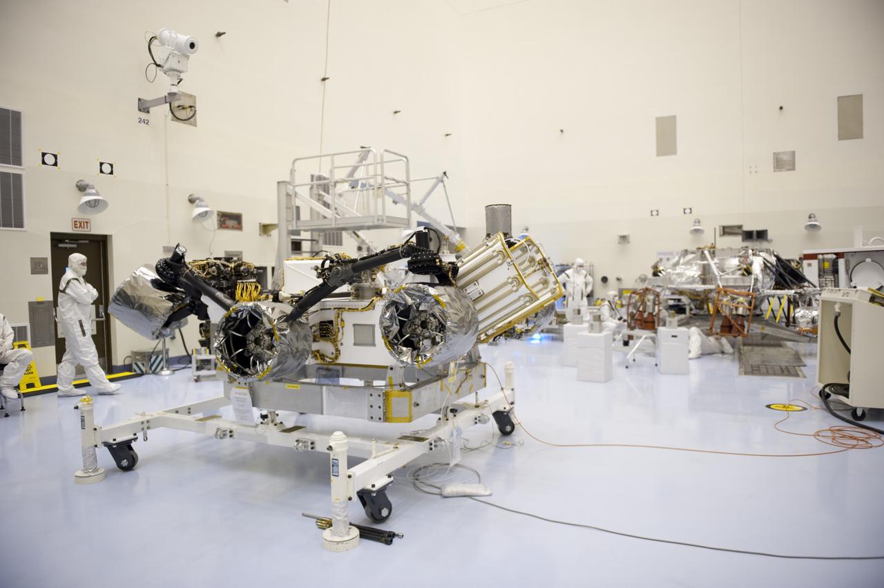 CAPE CANAVERAL, Fla. – At the Payload Hazardous Servicing Facility at NASA’s Kennedy Space Center in Florida, technicians prepare NASA's Mars Science Laboratory (MSL) rover, known as Curiosity, for integration with a rocket-powered descent stage.  The descent stage will lower Curiosity to the surface of Mars.     A United Launch Alliance Atlas V-541 configuration will be used to loft MSL into space. Curiosity’s 10 science instruments are designed to search for evidence on whether Mars has had environments favorable to microbial life, including chemical ingredients for life.  The unique rover will use a laser to look inside rocks and release its gasses so that the rover’s spectrometer can analyze and send the data back to Earth. MSL is scheduled to launch Nov. 25 with a window extending to Dec. 18 and arrival at Mars Aug. 2012. For more information, visit http://www.nasa.gov/msl. Photo credit: NASA/Kim Shiflett