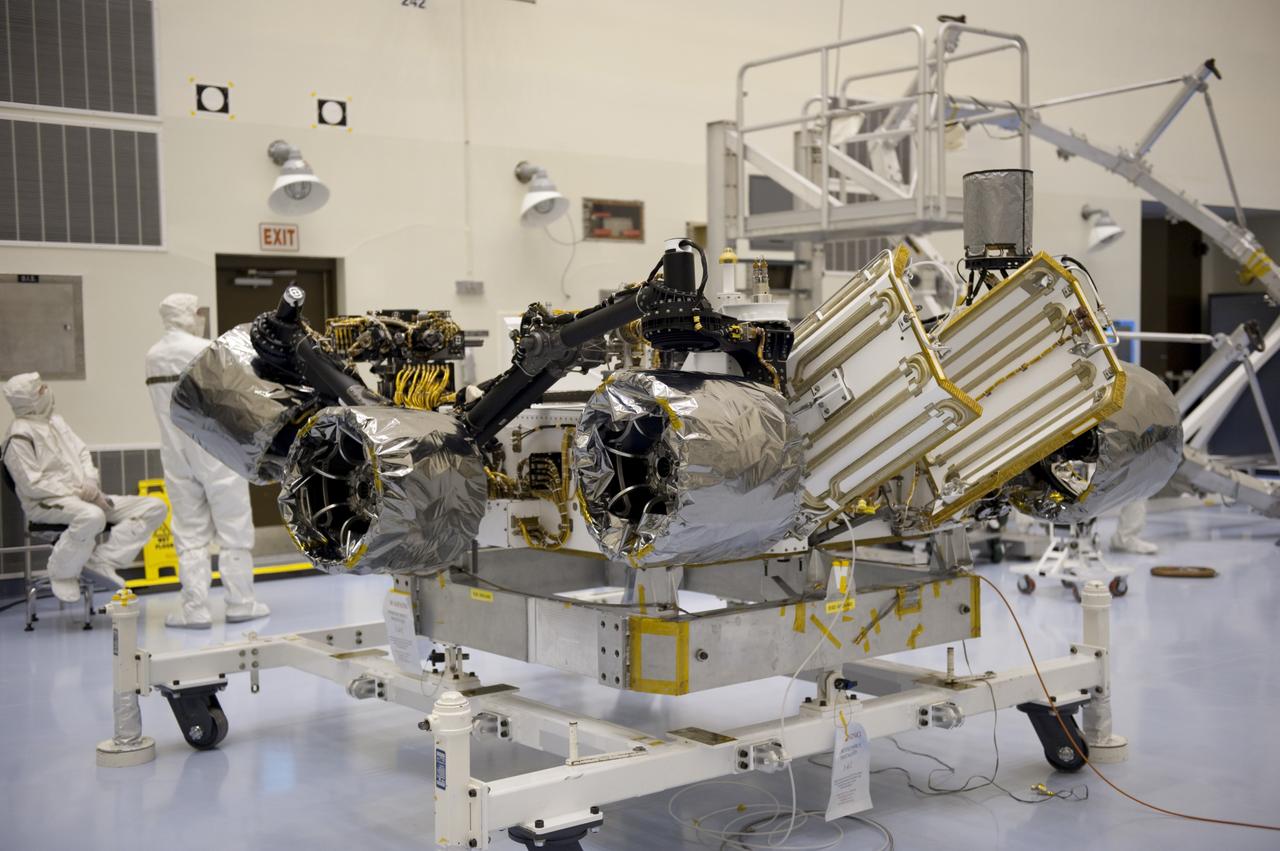 CAPE CANAVERAL, Fla. – At the Payload Hazardous Servicing Facility at NASA’s Kennedy Space Center in Florida, NASA's Mars Science Laboratory (MSL) rover, known as Curiosity, will be integrated with a rocket-powered descent stage.  The descent stage will lower Curiosity to the surface of Mars.     A United Launch Alliance Atlas V-541 configuration will be used to loft MSL into space. Curiosity’s 10 science instruments are designed to search for evidence on whether Mars has had environments favorable to microbial life, including chemical ingredients for life.  The unique rover will use a laser to look inside rocks and release its gasses so that the rover’s spectrometer can analyze and send the data back to Earth. MSL is scheduled to launch Nov. 25 with a window extending to Dec. 18 and arrival at Mars Aug. 2012. For more information, visit http://www.nasa.gov/msl. Photo credit: NASA/Kim Shiflett