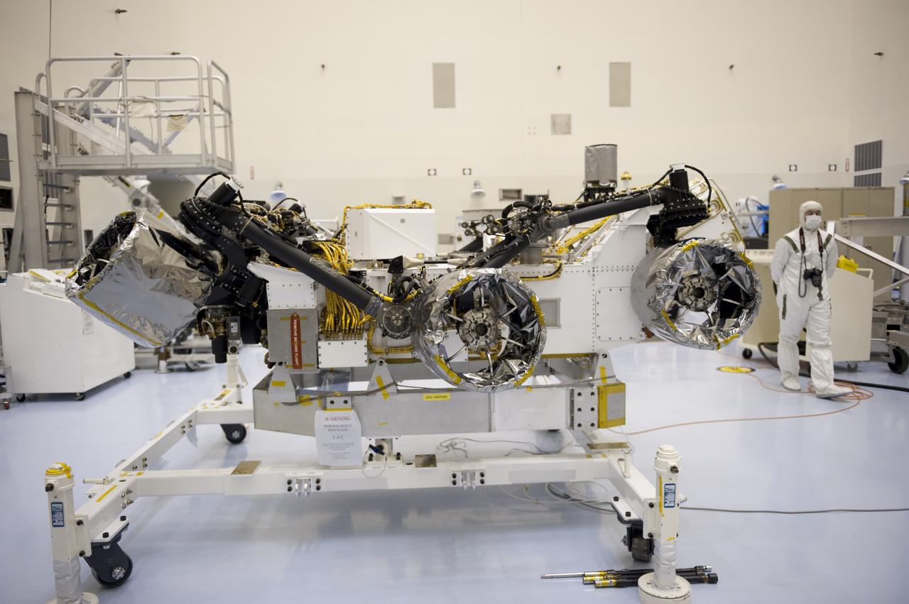 CAPE CANAVERAL, Fla. – At the Payload Hazardous Servicing Facility at NASA’s Kennedy Space Center in Florida, NASA's Mars Science Laboratory (MSL) rover, known as Curiosity, will be integrated with a rocket-powered descent stage.  The descent stage will lower Curiosity to the surface of Mars.     A United Launch Alliance Atlas V-541 configuration will be used to loft MSL into space. Curiosity’s 10 science instruments are designed to search for evidence on whether Mars has had environments favorable to microbial life, including chemical ingredients for life.  The unique rover will use a laser to look inside rocks and release its gasses so that the rover’s spectrometer can analyze and send the data back to Earth. MSL is scheduled to launch Nov. 25 with a window extending to Dec. 18 and arrival at Mars Aug. 2012. For more information, visit http://www.nasa.gov/msl. Photo credit: NASA/Kim Shiflett
