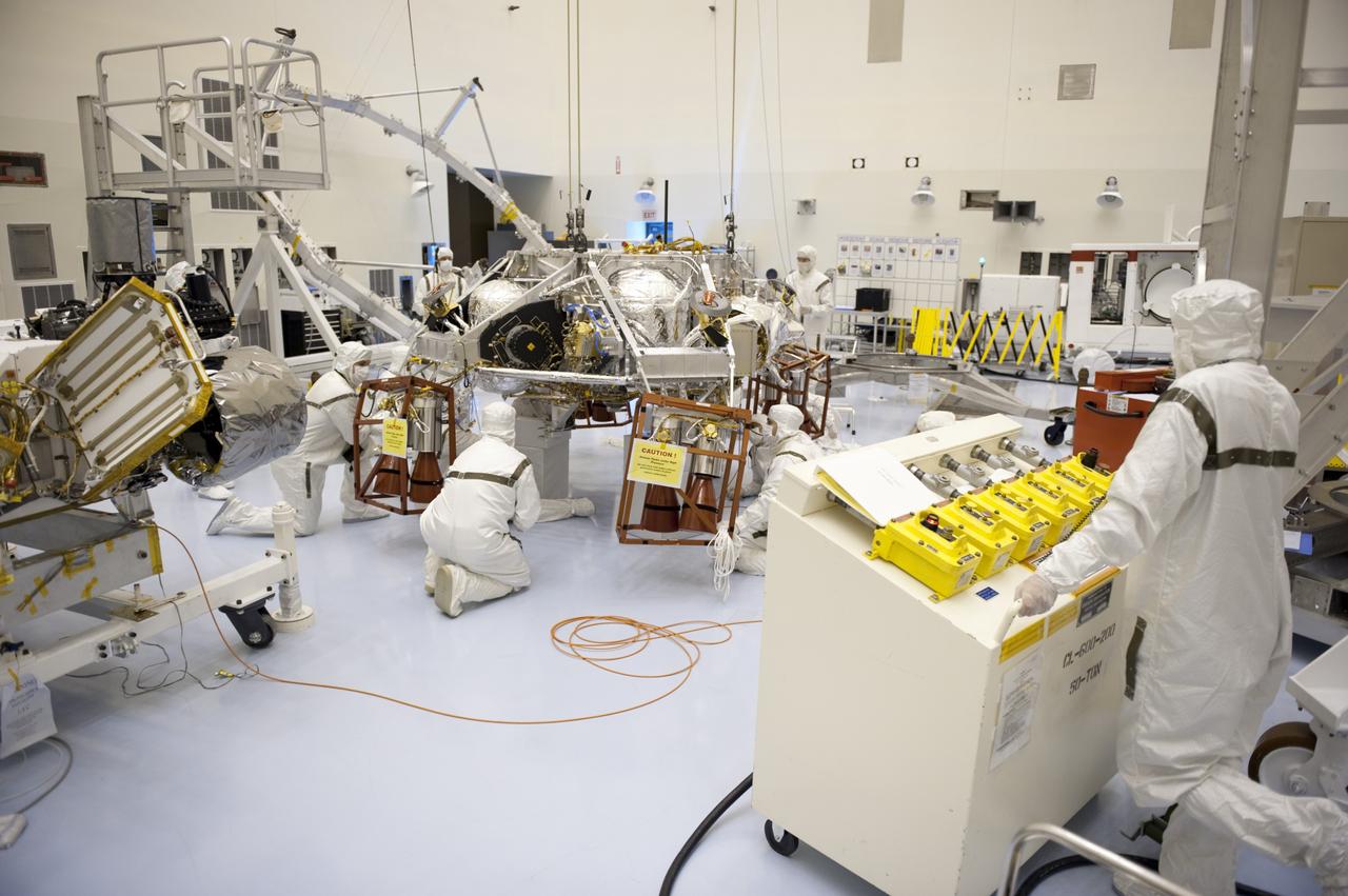CAPE CANAVERAL, Fla. – At the Payload Hazardous Servicing Facility at NASA's Kennedy Space Center in Florida, technicians use an overhead crane to move a rocket-powered descent stage for integration with NASA's Mars Science Laboratory (MSL) rover, known as Curiosity. The descent stage will lower Curiosity to the surface of Mars.     A United Launch Alliance Atlas V-541 configuration will be used to loft MSL into space. Curiosity’s 10 science instruments are designed to search for evidence on whether Mars has had environments favorable to microbial life, including chemical ingredients for life.  The unique rover will use a laser to look inside rocks and release its gasses so that the rover’s spectrometer can analyze and send the data back to Earth. MSL is scheduled to launch Nov. 25 with a window extending to Dec. 18 and arrival at Mars Aug. 2012. For more information, visit http://www.nasa.gov/msl. Photo credit: NASA/Kim Shiflett