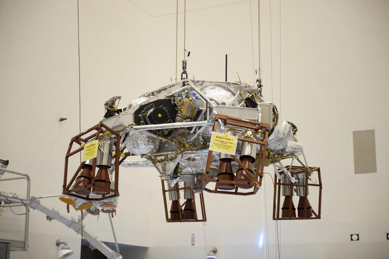 CAPE CANAVERAL, Fla. – At the Payload Hazardous Servicing Facility at NASA's Kennedy Space Center in Florida, an overhead crane lifts a rocket-powered descent stage for integration with NASA's Mars Science Laboratory (MSL) rover, known as Curiosity. The descent stage will lower Curiosity to the surface of Mars.     A United Launch Alliance Atlas V-541 configuration will be used to loft MSL into space. Curiosity’s 10 science instruments are designed to search for evidence on whether Mars has had environments favorable to microbial life, including chemical ingredients for life.  The unique rover will use a laser to look inside rocks and release its gasses so that the rover’s spectrometer can analyze and send the data back to Earth. MSL is scheduled to launch Nov. 25 with a window extending to Dec. 18 and arrival at Mars Aug. 2012. For more information, visit http://www.nasa.gov/msl. Photo credit: NASA/Kim Shiflett