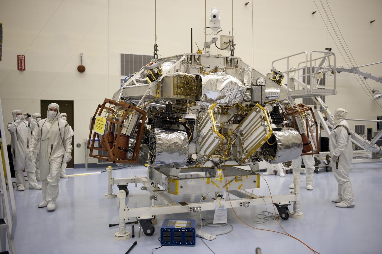 CAPE CANAVERAL, Fla. – At the Payload Hazardous Servicing Facility at NASA’s Kennedy Space Center in Florida, a rocket-powered descent stage, after being lowered by an overhead crane, is integrated with NASA's Mars Science Laboratory (MSL) rover, known as Curiosity. The descent stage will lower Curiosity to the surface of Mars.     A United Launch Alliance Atlas V-541 configuration will be used to loft MSL into space. Curiosity’s 10 science instruments are designed to search for evidence on whether Mars has had environments favorable to microbial life, including chemical ingredients for life.  The unique rover will use a laser to look inside rocks and release its gasses so that the rover’s spectrometer can analyze and send the data back to Earth. MSL is scheduled to launch Nov. 25 with a window extending to Dec. 18 and arrival at Mars Aug. 2012. For more information, visit http://www.nasa.gov/msl. Photo credit: NASA/Kim Shiflett