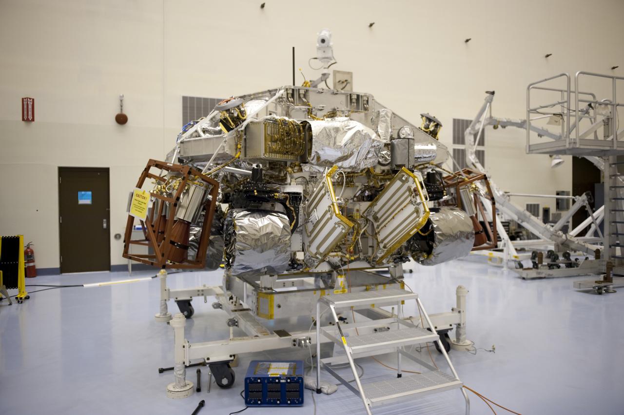 CAPE CANAVERAL, Fla. – At the Payload Hazardous Servicing Facility at NASA’s Kennedy Space Center in Florida, integration between a rocket-powered descent stage and NASA's Mars Science Laboratory (MSL) rover, known as Curiosity, is complete. The descent stage will lower Curiosity to the surface of Mars.     A United Launch Alliance Atlas V-541 configuration will be used to loft MSL into space. Curiosity’s 10 science instruments are designed to search for evidence on whether Mars has had environments favorable to microbial life, including chemical ingredients for life.  The unique rover will use a laser to look inside rocks and release its gasses so that the rover’s spectrometer can analyze and send the data back to Earth. MSL is scheduled to launch Nov. 25 with a window extending to Dec. 18 and arrival at Mars Aug. 2012. For more information, visit http://www.nasa.gov/msl. Photo credit: NASA/Kim Shiflett