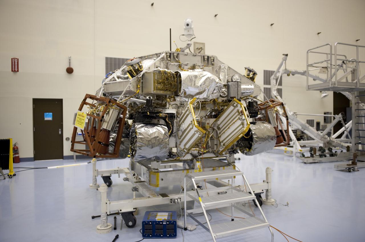 CAPE CANAVERAL, Fla. – At the Payload Hazardous Servicing Facility at NASA’s Kennedy Space Center in Florida, integration between a rocket-powered descent stage and NASA's Mars Science Laboratory (MSL) rover, known as Curiosity, is complete. The descent stage will lower Curiosity to the surface of Mars.     A United Launch Alliance Atlas V-541 configuration will be used to loft MSL into space. Curiosity’s 10 science instruments are designed to search for evidence on whether Mars has had environments favorable to microbial life, including chemical ingredients for life.  The unique rover will use a laser to look inside rocks and release its gasses so that the rover’s spectrometer can analyze and send the data back to Earth. MSL is scheduled to launch Nov. 25 with a window extending to Dec. 18 and arrival at Mars Aug. 2012. For more information, visit http://www.nasa.gov/msl. Photo credit: NASA/Kim Shiflett