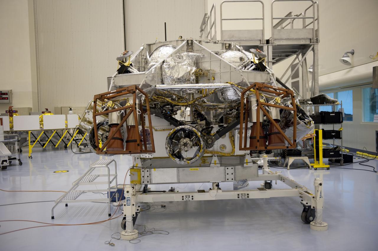 CAPE CANAVERAL, Fla. – At the Payload Hazardous Servicing Facility at NASA’s Kennedy Space Center in Florida, integration between a rocket-powered descent stage and NASA's Mars Science Laboratory (MSL) rover, known as Curiosity, is complete. The descent stage will lower Curiosity to the surface of Mars.     A United Launch Alliance Atlas V-541 configuration will be used to loft MSL into space. Curiosity’s 10 science instruments are designed to search for evidence on whether Mars has had environments favorable to microbial life, including chemical ingredients for life.  The unique rover will use a laser to look inside rocks and release its gasses so that the rover’s spectrometer can analyze and send the data back to Earth. MSL is scheduled to launch Nov. 25 with a window extending to Dec. 18 and arrival at Mars Aug. 2012. For more information, visit http://www.nasa.gov/msl. Photo credit: NASA/Kim Shiflett
