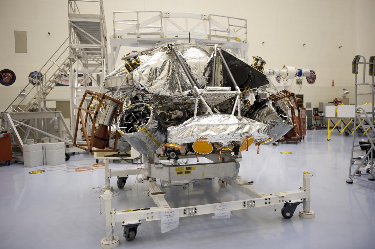 CAPE CANAVERAL, Fla. – At the Payload Hazardous Servicing Facility at NASA’s Kennedy Space Center in Florida, integration between a rocket-powered descent stage and NASA's Mars Science Laboratory (MSL) rover, known as Curiosity, is complete. The descent stage will lower Curiosity to the surface of Mars. A United Launch Alliance Atlas V-541 configuration will be used to loft MSL into space. Curiosity’s 10 science instruments are designed to search for evidence on whether Mars has had environments favorable to microbial life, including chemical ingredients for life. The unique rover will use a laser to look inside rocks and release its gasses so that the rover’s spectrometer can analyze and send the data back to Earth. MSL is scheduled to launch Nov. 25 with a window extending to Dec. 18 and arrival at Mars Aug. 2012. For more information, visit http://www.nasa.gov/msl. Photo credit: NASA/Kim Shiflett