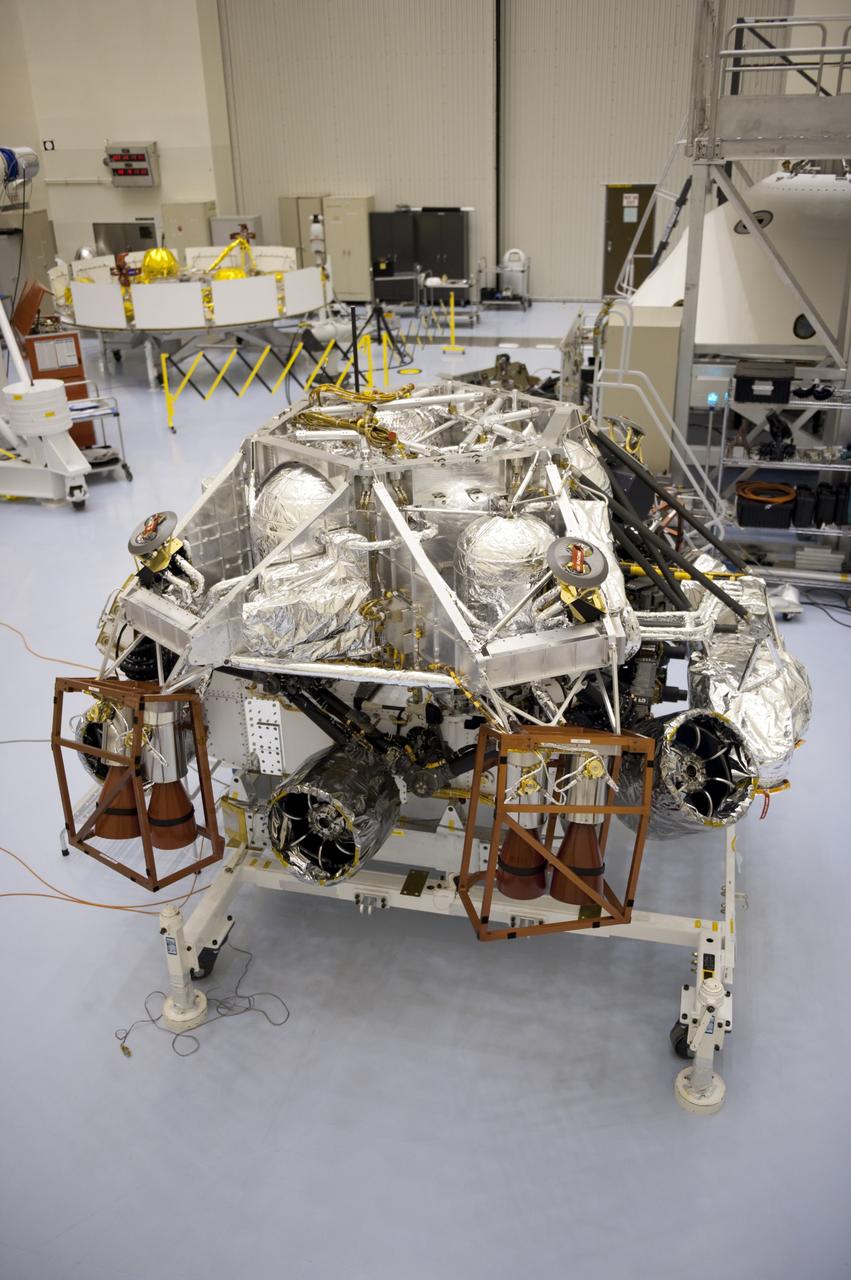 CAPE CANAVERAL, Fla. – At the Payload Hazardous Servicing Facility at NASA’s Kennedy Space Center in Florida, integration between a rocket-powered descent stage and NASA's Mars Science Laboratory (MSL) rover, known as Curiosity, is complete. The descent stage will lower Curiosity to the surface of Mars. A United Launch Alliance Atlas V-541 configuration will be used to loft MSL into space. Curiosity’s 10 science instruments are designed to search for evidence on whether Mars has had environments favorable to microbial life, including chemical ingredients for life. The unique rover will use a laser to look inside rocks and release its gasses so that the rover’s spectrometer can analyze and send the data back to Earth. MSL is scheduled to launch Nov. 25 with a window extending to Dec. 18 and arrival at Mars Aug. 2012. For more information, visit http://www.nasa.gov/msl. Photo credit: NASA/Kim Shiflett