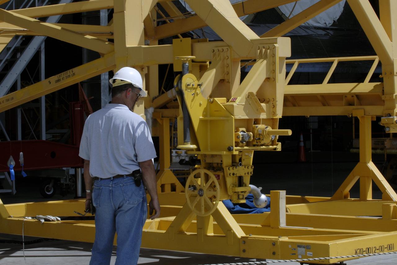 CAPE CANAVERAL, Fla. – At the Vehicle Assembly Building at NASA's Kennedy Space Center in Florida, a worker prepares an aerial lift which will be used to raise the Approach and Landing Test Assembly (ALTA) pod onto space shuttle Endeavour. The demonstration test is being conducted to ensure the center’s equipment will fit into the hangar at the National Air and Space Museum when installing an ALTA pod on shuttle Enterprise. The pod must be reinstalled on a shuttle for transport on a 747 carrier aircraft. The simulation also tests procedures and timelines necessary to carry out the process.       The work is part of the Space Shuttle Program’s transition and retirement processing. Enterprise, which was not equipped for space flight, was built as a test vehicle to demonstrate that the orbiter could fly in the atmosphere and land like an airplane. In 1985, Enterprise was ferried from the Kennedy Space Center to Dulles Airport, Washington, D.C., and became the property of the Smithsonian Institute. Enterprise will be moved from the Smithsonian Institution National Air and Space Museum's Steven F. Udvar-Hazy Center in Chantilly, Va., to the Intrepid Sea, Air and Space Museum in New York. For more information, visit http://www.nasa.gov/shuttle. Photo credit: NASA/Ken Shiflett