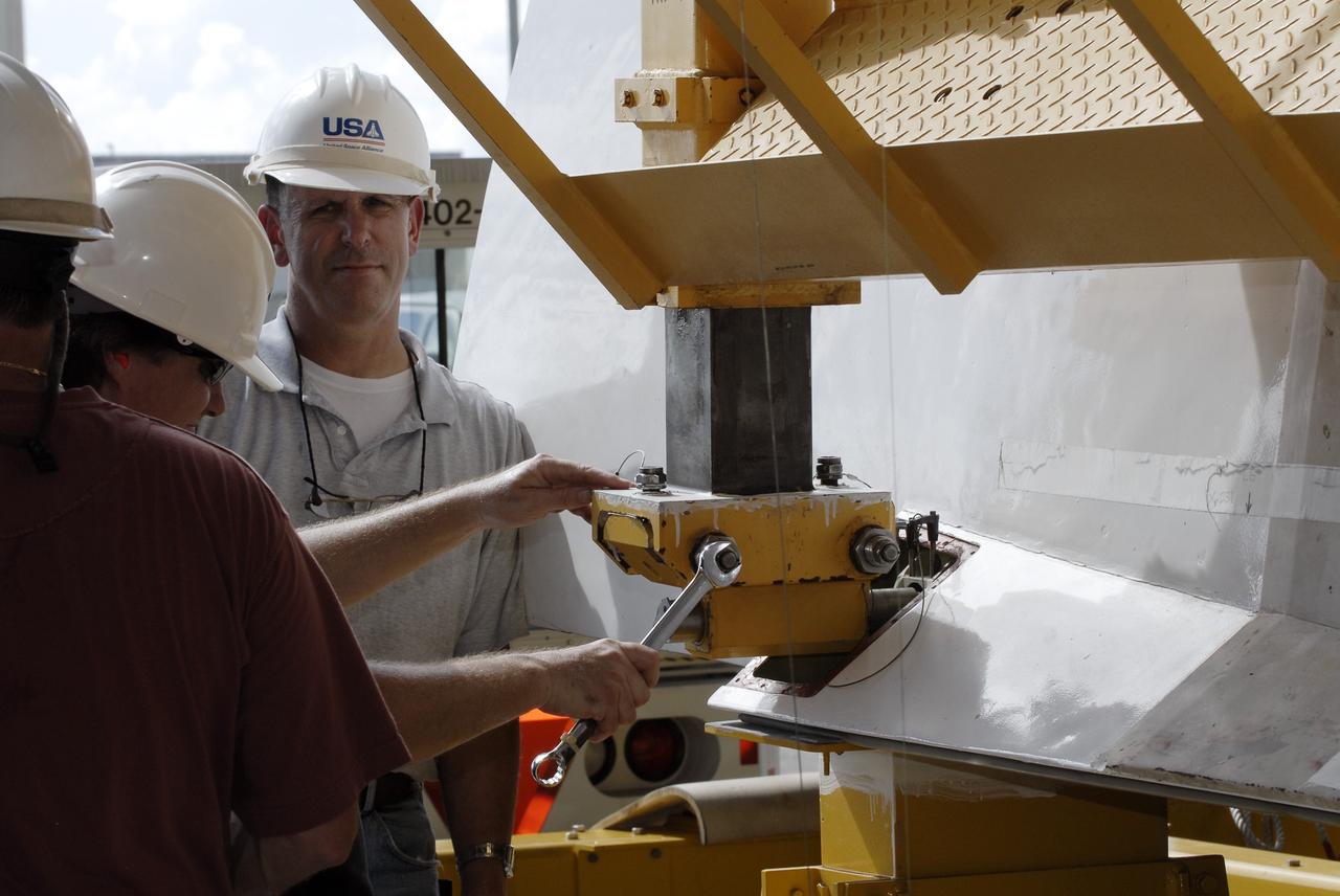 CAPE CANAVERAL, Fla. – At the Vehicle Assembly Building at NASA's Kennedy Space Center in Florida, workers use an aerial lift to raise the Approach and Landing Test Assembly (ALTA) pod onto space shuttle Endeavour. The demonstration test is being conducted to ensure the center’s equipment will fit into the hangar at the National Air and Space Museum when installing an ALTA pod on shuttle Enterprise. The pod must be reinstalled on a shuttle for transport on a 747 carrier aircraft. The simulation also tests procedures and timelines necessary to carry out the process.       The work is part of the Space Shuttle Program’s transition and retirement processing. Enterprise, which was not equipped for space flight, was built as a test vehicle to demonstrate that the orbiter could fly in the atmosphere and land like an airplane. In 1985, Enterprise was ferried from the Kennedy Space Center to Dulles Airport, Washington, D.C., and became the property of the Smithsonian Institute. Enterprise will be moved from the Smithsonian Institution National Air and Space Museum's Steven F. Udvar-Hazy Center in Chantilly, Va., to the Intrepid Sea, Air and Space Museum in New York. For more information, visit http://www.nasa.gov/shuttle. Photo credit: NASA/Ken Shiflett