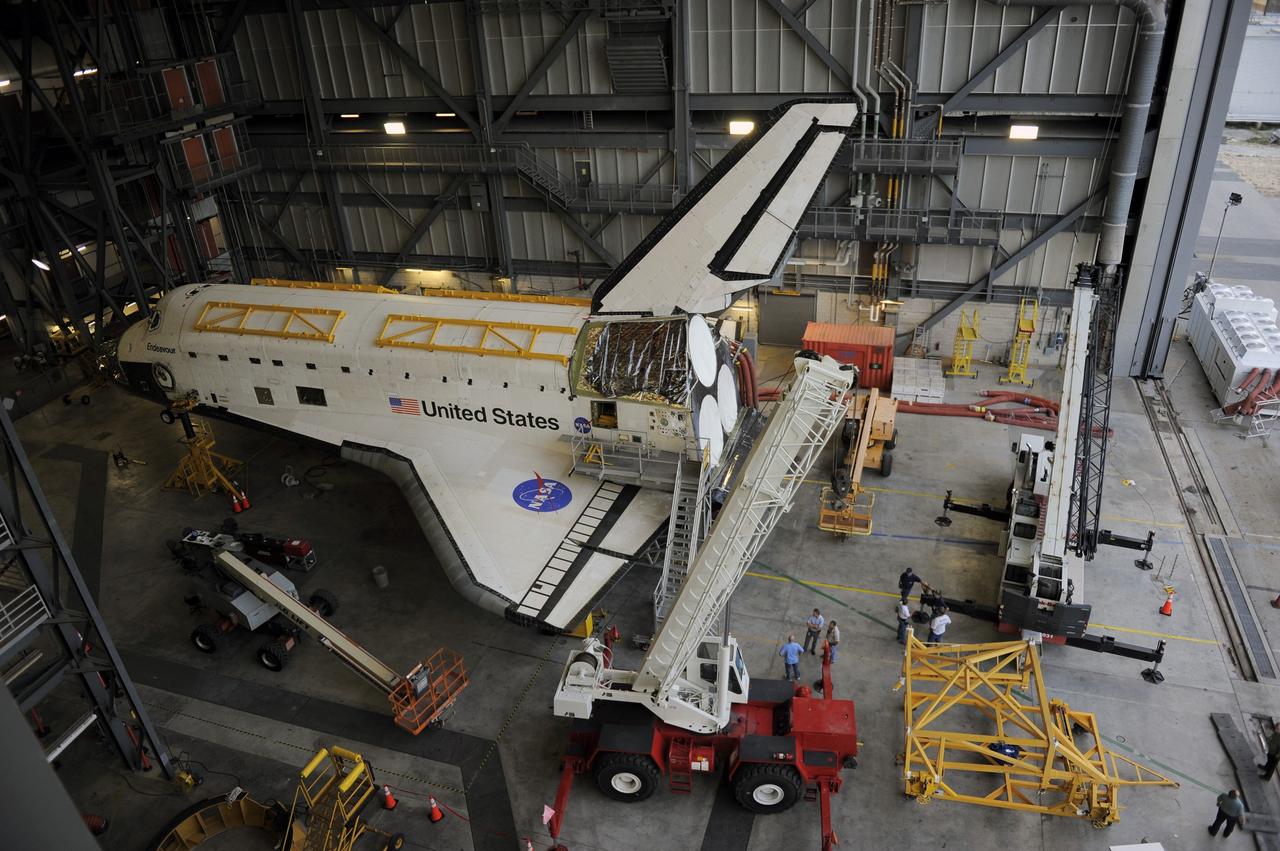CAPE CANAVERAL, Fla. – In the Vehicle Assembly Building at NASA's Kennedy Space Center in Florida, space shuttle Endeavour sits surrounded by cranes and lifts. Workers are preparing to raise an Approach and Landing Test Assembly (ALTA) pod for attachment to the shuttle at the site once housing the orbital maneuvering system (OMS) pod. The demonstration test is being conducted to ensure the center’s equipment will fit into the hangar at the National Air and Space Museum when installing an ALTA pod on shuttle Enterprise. The pod must be reinstalled on a shuttle for transport on a 747 carrier aircraft. The simulation also tests procedures and timelines necessary to carry out the process.       The work is part of the Space Shuttle Program’s transition and retirement processing. Enterprise, which was not equipped for space flight, was built as a test vehicle to demonstrate that the orbiter could fly in the atmosphere and land like an airplane. In 1985, Enterprise was ferried from the Kennedy Space Center to Dulles Airport, Washington, D.C., and became the property of the Smithsonian Institute. Enterprise will be moved from the Smithsonian Institution National Air and Space Museum's Steven F. Udvar-Hazy Center in Chantilly, Va., to the Intrepid Sea, Air and Space Museum in New York. For more information, visit http://www.nasa.gov/shuttle. Photo credit: NASA/Ken Shiflett