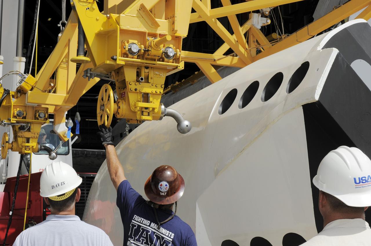 CAPE CANAVERAL, Fla. – In the Vehicle Assembly Building at NASA's Kennedy Space Center in Florida, workers, using overhead cranes, raise a cage over an Approach and Landing Test Assembly (ALTA) pod. The ALTA pod will be lifted for attachment to space shuttle Endeavour on the site once housing the orbital maneuvering system (OMS) pod. The demonstration test is being conducted to ensure the center’s equipment will fit into the hangar at the National Air and Space Museum when installing an ALTA pod on shuttle Enterprise. The pod must be reinstalled on a shuttle for transport on a 747 carrier aircraft. The simulation also tests procedures and timelines necessary to carry out the process.       The work is part of the Space Shuttle Program’s transition and retirement processing. Enterprise, which was not equipped for space flight, was built as a test vehicle to demonstrate that the orbiter could fly in the atmosphere and land like an airplane. In 1985, Enterprise was ferried from the Kennedy Space Center to Dulles Airport, Washington, D.C., and became the property of the Smithsonian Institute. Enterprise will be moved from the Smithsonian Institution National Air and Space Museum's Steven F. Udvar-Hazy Center in Chantilly, Va., to the Intrepid Sea, Air and Space Museum in New York. For more information, visit http://www.nasa.gov/shuttle. Photo credit: NASA/Ken Shiflett