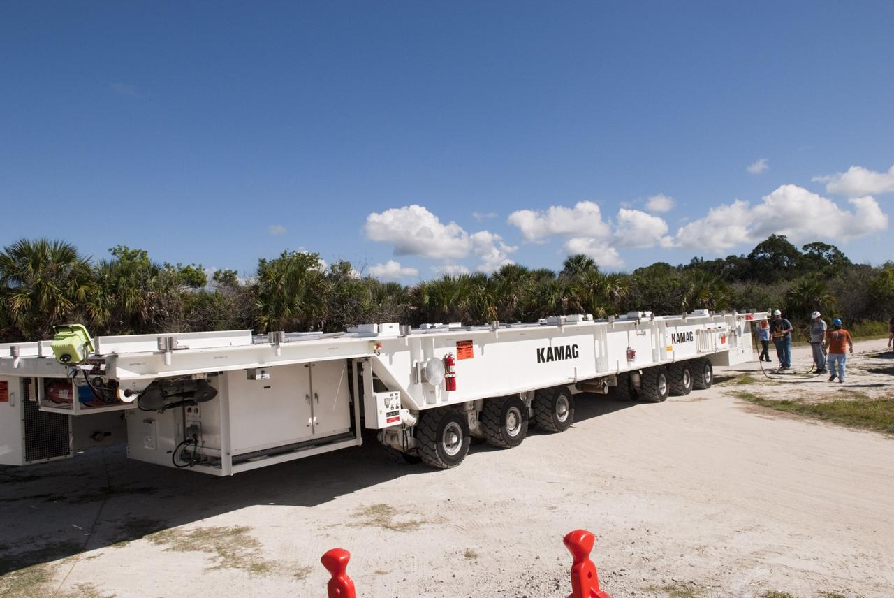 CAPE CANAVERAL, Fla. -- This transporter has moved its last space shuttle payload canister.  The transporter was enlisted to move payload canister #2 from the Canister Rotation Facility to the Reutilization, Recycling and Marketing Facility on Ransom Road at NASA's Kennedy Space Center in Florida.    The two payload canisters used to transport space shuttle payloads to the launch pad for installation in the shuttles' cargo bays are being decommissioned following the end of the Space Shuttle Program. Each canister weighs 110,000 pounds and is 65 feet long, 22 feet wide, and 18 feet, 7 inches high.  The canisters were prescreened through NASA Headquarters as possible artifacts, but their size makes them difficult to transport to locations off the center. Federal and state agencies now will be given the opportunity to screen the canisters for potential use before a final decision is made on their disposition.  For more information, visit http://www.nasa.gov/centers/kennedy/pdf/167403main_CRF-06.pdf. Photo credit: NASA/Jim Grossmann