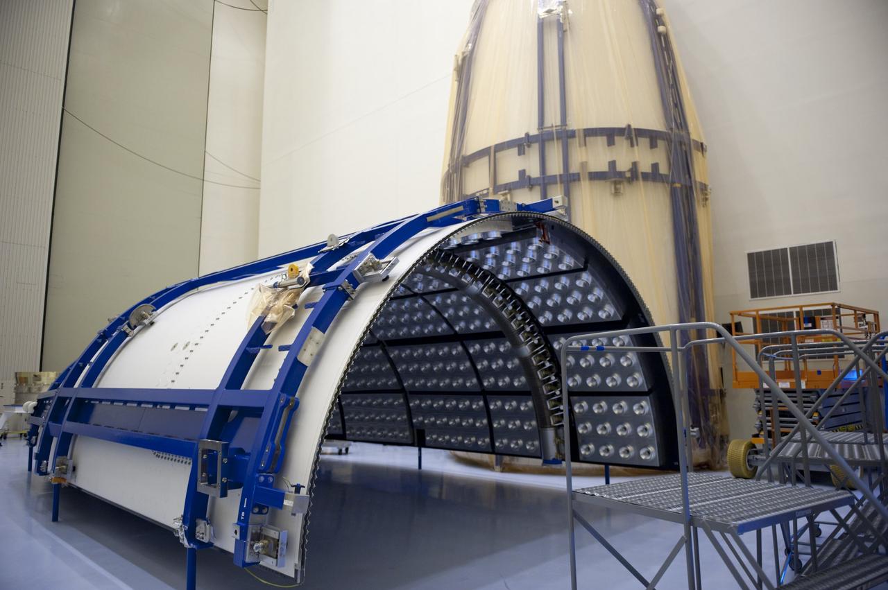 CAPE CANAVERAL, Fla. -- In the Payload Hazardous Servicing Facility at NASA's Kennedy Space Center in Florida, half of the Atlas V payload fairing for NASA's Mars Science Laboratory (MSL) mission is uncovered during preparations to clean it to meet NASA's planetary protection requirements. In the background is the other half of the fairing, still uncovered. The fairing will protect the spacecraft from the impact of aerodynamic pressure and heating during ascent. Although jettisoned once the spacecraft is outside the Earth's atmosphere, the fairing must be cleaned to the same exacting standards as the laboratory to avoid the possibility of contaminating it. MSL's components include a compact car-sized rover, Curiosity, which has 10 science instruments designed to search for evidence on whether Mars has had environments favorable to microbial life, including the chemical ingredients for life. The unique rover will use a laser to look inside rocks and release its gasses so that the rover’s spectrometer can analyze and send the data back to Earth. Launch of MSL aboard a United Launch Alliance Atlas V rocket is planned for Nov. 25 from Space Launch Complex 41 on Cape Canaveral Air Force Station. For more information, visit http://www.nasa.gov/msl. Photo credit: NASA/Kim Shiflett