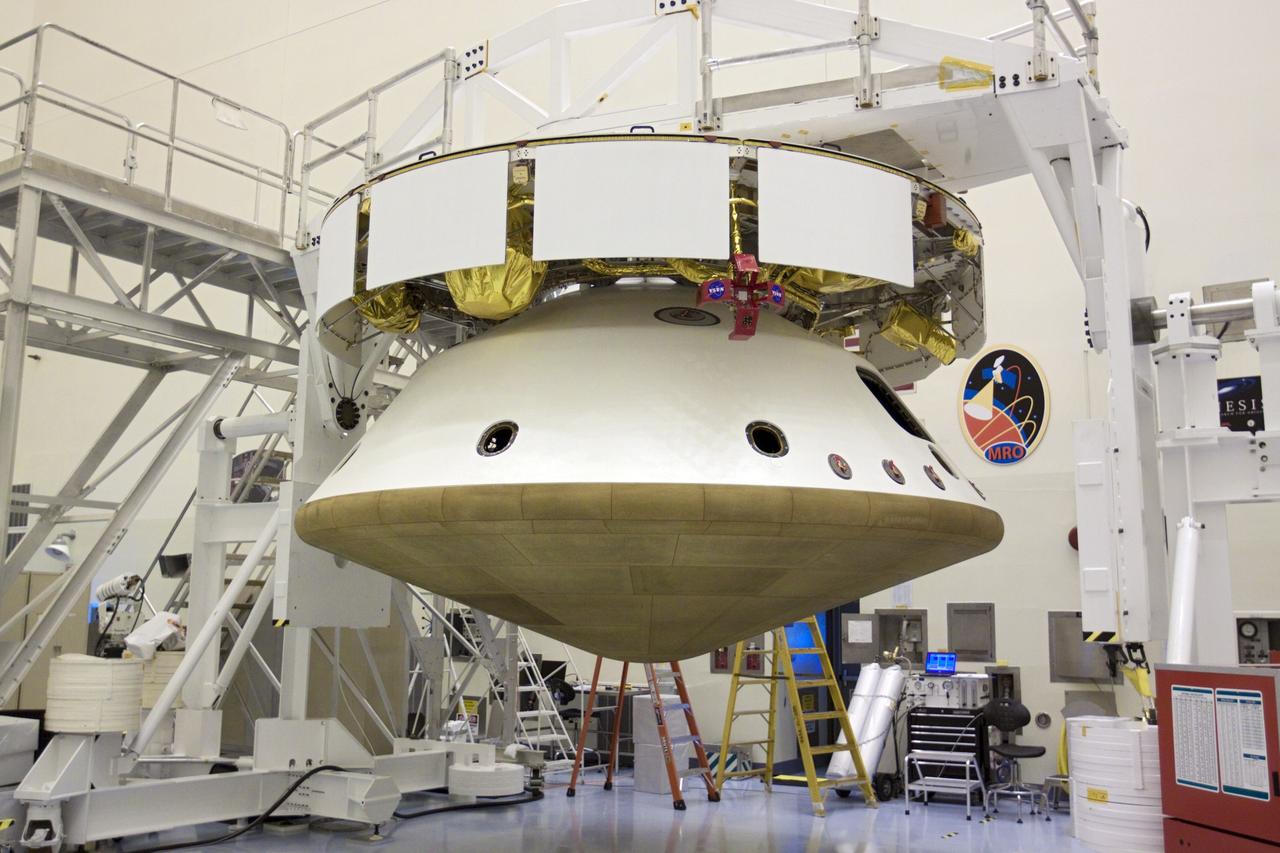 CAPE CANAVERAL, Fla. – In the Payload Hazardous Servicing Facility at NASA’s Kennedy Space Center in Florida, all elements of NASA's Mars Science Laboratory (MSL) mission have come together. The top portion is the cruise stage, next, the aeroshell, (containing the compact car-sized rover Curiosity), and on the bottom, the heat shield. The rover Curiosity has 10 science instruments designed to search for evidence on whether Mars has had environments favorable to microbial life, including chemical ingredients for life. The unique rover will use a laser to look inside rocks and release its gasses so that the rover’s spectrometer can analyze and send the data back to Earth. Launch of MSL aboard a United Launch Alliance Atlas V rocket is scheduled for Nov. 25 from Space Launch Complex 41 on Cape Canaveral Air Force Station in Florida. For more information, visit http://www.nasa.gov/msl. Photo credit: NASA/Glenn Benson