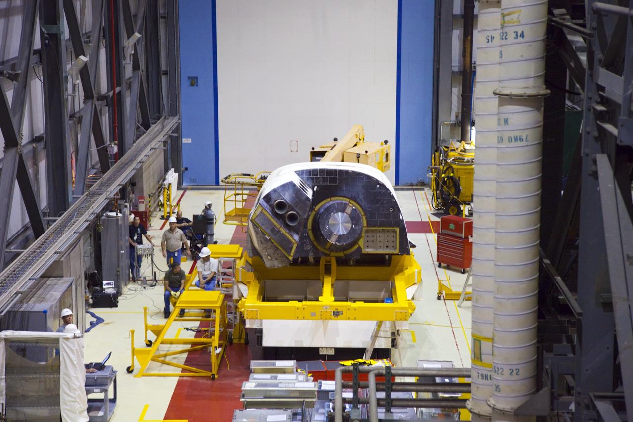 CAPE CANAVERAL, Fla. – At NASA’s Kennedy Space Center in Florida, an orbital maneuvering system (OMS) pod awaits installation on space shuttle Discovery in Orbiter Processing Facility-1.    The OMS pod was returned from White Sands Space Harbor in New Mexico where it underwent a complete deservicing and cleaning. The work is part of the Space Shuttle Program’s transition and retirement processing of space shuttle Discovery. The shuttle will go to the Smithsonian’s National Air and Space Museum, Steven F. Udvar-Hazy Center in Chantilly, Va., in April 2012. For more information, visit http://www.nasa.gov/shuttle.  Photo credit: NASA/Frankie Martin