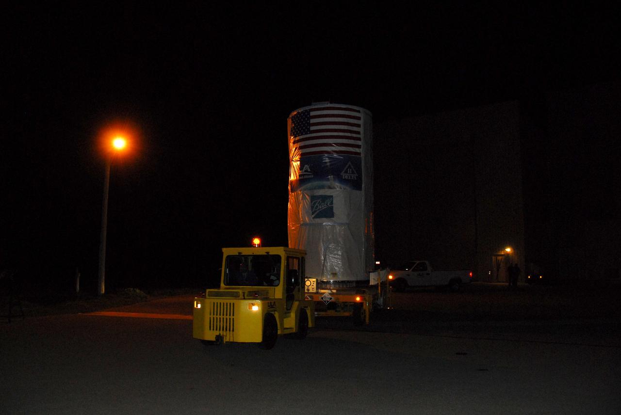 Tucked inside a protective payload transportation canister, NASA’s National Polar-orbiting Operational Environmental Satellite System Preparatory Project (NPP) spacecraft is trucked to launch pad.    NPP represents a critical first step in building the next-generation of Earth-observing satellites. NPP will carry the first of the new sensors developed for this satellite fleet, now known as the Joint Polar Satellite System (JPSS), to be launched in 2016. NPP is the bridge between NASA's Earth Observing System (EOS) satellites and the forthcoming series of JPSS satellites. The mission will test key technologies and instruments for the JPSS missions. NPP is targeted to launch Oct. 28 from Space Launch Complex-2 aboard a United Launch Alliance Delta II rocket. For more information, visit http://www.nasa.gov/NPP.  Photo credit: NASA/VAFB