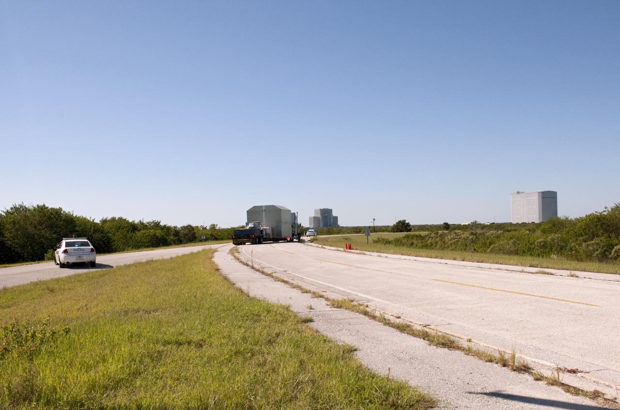 A truck brings the latest Space Exploration Technologies Corp. (SpaceX) Dragon capsule to Cape Canaveral Air Force Station in Florida on Oct. 23 so it can be processed and attached to the top of a Falcon 9 rocket on Space Launch Complex-40 for the company's next demonstration test flight for NASA's Commercial Orbital Transportation Services (COTS) program.    SpaceX is one of two companies under contract with NASA to take cargo to the International Space Station. NASA is working with SpaceX to combine its last two demonstration flights, and if approved, the Falcon 9 rocket would launch the Dragon capsule to the orbiting laboratory for a docking within the next several months. Photo credit: NASA/ Charisse Nahser