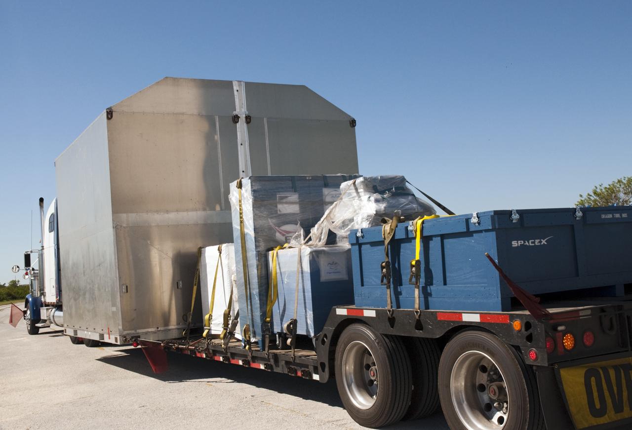 A truck carries the latest Space Exploration Technologies Corp. (SpaceX) Dragon capsule to Cape Canaveral Air Force Station in Florida on Oct. 23 so it can be processed and attached to the top of a Falcon 9 rocket on Space Launch Complex-40 for the company's next demonstration test flight for NASA's Commercial Orbital Transportation Services (COTS) program.    SpaceX is one of two companies under contract with NASA to take cargo to the International Space Station. NASA is working with SpaceX to combine its last two demonstration flights, and if approved, the Falcon 9 rocket would launch the Dragon capsule to the orbiting laboratory for a docking within the next several months. Photo credit: NASA/ Charisse Nahser