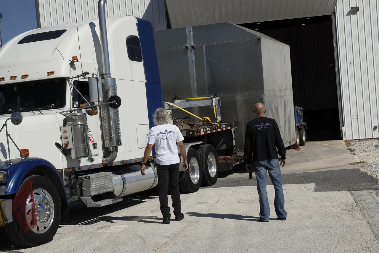 A truck carries the latest Space Exploration Technologies Corp. (SpaceX) Dragon capsule to Cape Canaveral Air Force Station in Florida on Oct. 23 so it can be processed and attached to the top of a Falcon 9 rocket on Space Launch Complex-40 for the company's next demonstration test flight for NASA's Commercial Orbital Transportation Services (COTS) program.    SpaceX is one of two companies under contract with NASA to take cargo to the International Space Station. NASA is working with SpaceX to combine its last two demonstration flights, and if approved, the Falcon 9 rocket would launch the Dragon capsule to the orbiting laboratory for a docking within the next several months. Photo credit: NASA/ Charisse Nahser