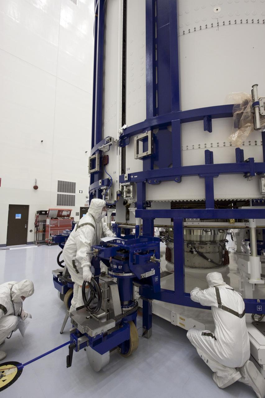 CAPE CANAVERAL, Fla. - In the Payload Hazardous Servicing Facility at NASA's Kennedy Space Center in Florida, spacecraft technicians align the sections of an Atlas V rocket payload fairing around NASA's Mars Science Laboratory (MSL). Next, the lab will be transported to the launch pad. The fairing will protect the spacecraft from the impact of aerodynamic pressure and heating during ascent. MSL's components include a compact car-sized rover, Curiosity, which has 10 science instruments designed to search for evidence on whether Mars has had environments favorable to microbial life, including the chemical ingredients for life. The unique rover will use a laser to look inside rocks and release its gasses so that the rover’s spectrometer can analyze and send the data back to Earth. Launch of MSL aboard a United Launch Alliance Atlas V rocket is planned for Nov. 25 from Space Launch Complex-41 on Cape Canaveral Air Force Station. For more information, visit http://www.nasa.gov/msl. Photo credit: NASA/Jim Grossmann