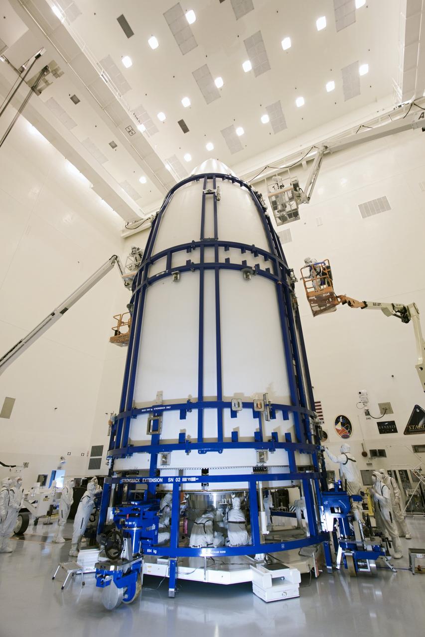 CAPE CANAVERAL, Fla. - In the Payload Hazardous Servicing Facility at NASA's Kennedy Space Center in Florida, spacecraft technicians secure an Atlas V rocket payload fairing around NASA's Mars Science Laboratory (MSL). Next, the lab will be transported to the launch pad. The fairing will protect the spacecraft from the impact of aerodynamic pressure and heating during ascent. MSL's components include a compact car-sized rover, Curiosity, which has 10 science instruments designed to search for evidence on whether Mars has had environments favorable to microbial life, including the chemical ingredients for life. The unique rover will use a laser to look inside rocks and release its gasses so that the rover’s spectrometer can analyze and send the data back to Earth. Launch of MSL aboard a United Launch Alliance Atlas V rocket is planned for Nov. 25 from Space Launch Complex-41 on Cape Canaveral Air Force Station. For more information, visit http://www.nasa.gov/msl. Photo credit: NASA/Jim Grossmann
