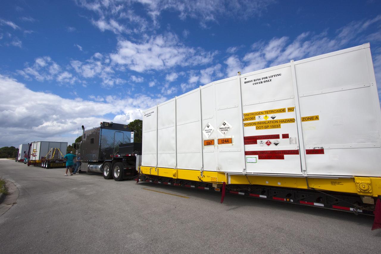 CAPE CANAVERAL, Fla. – Outside the Hazardous Maintenance Facility at NASA's Kennedy Space Center in Florida, space shuttle Endeavour’s left and right orbital maneuvering system (OMS) pods and forward reaction control system (FRCS) are secured in several containers and ready for transport to White Sands Space Harbor in New Mexico.     The work is part of the Space Shuttle Program’s transition and retirement processing of shuttle Endeavour. At White Sands the OMS pods and FRCS will undergo a complete deservicing and cleaning and then be returned to Kennedy for reinstallation on Endeavour. Endeavour is being prepared for display at the California Science Center in Los Angeles.  Photo credit: NASA/Jim Grossmann