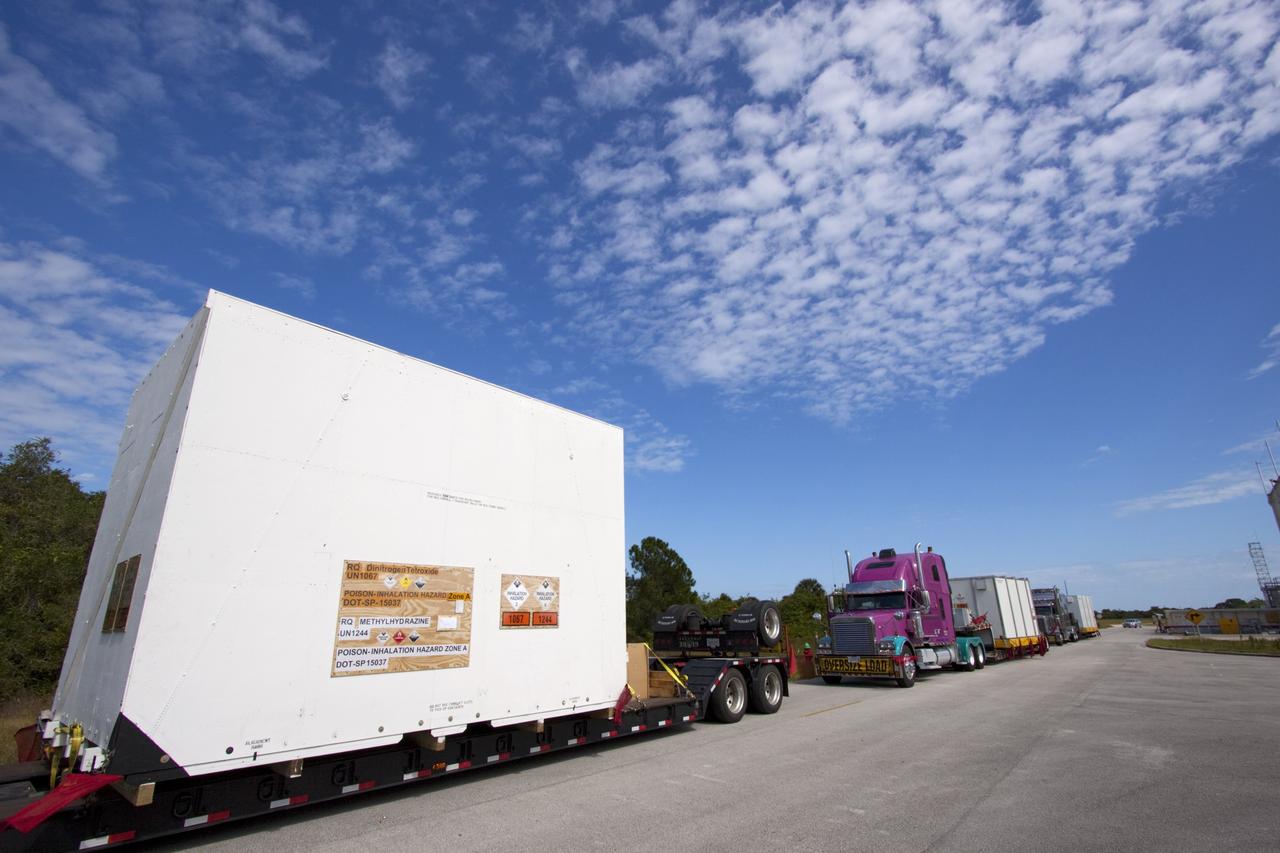 CAPE CANAVERAL, Fla. – Outside the Hazardous Maintenance Facility at NASA's Kennedy Space Center in Florida, space shuttle Endeavour’s left and right orbital maneuvering system (OMS) pods and forward reaction control system (FRCS) are secured in several containers and ready for transport to White Sands Space Harbor in New Mexico.     The work is part of the Space Shuttle Program’s transition and retirement processing of shuttle Endeavour. At White Sands the OMS pods and FRCS will undergo a complete deservicing and cleaning and then be returned to Kennedy for reinstallation on Endeavour. Endeavour is being prepared for display at the California Science Center in Los Angeles.  Photo credit: NASA/Jim Grossmann