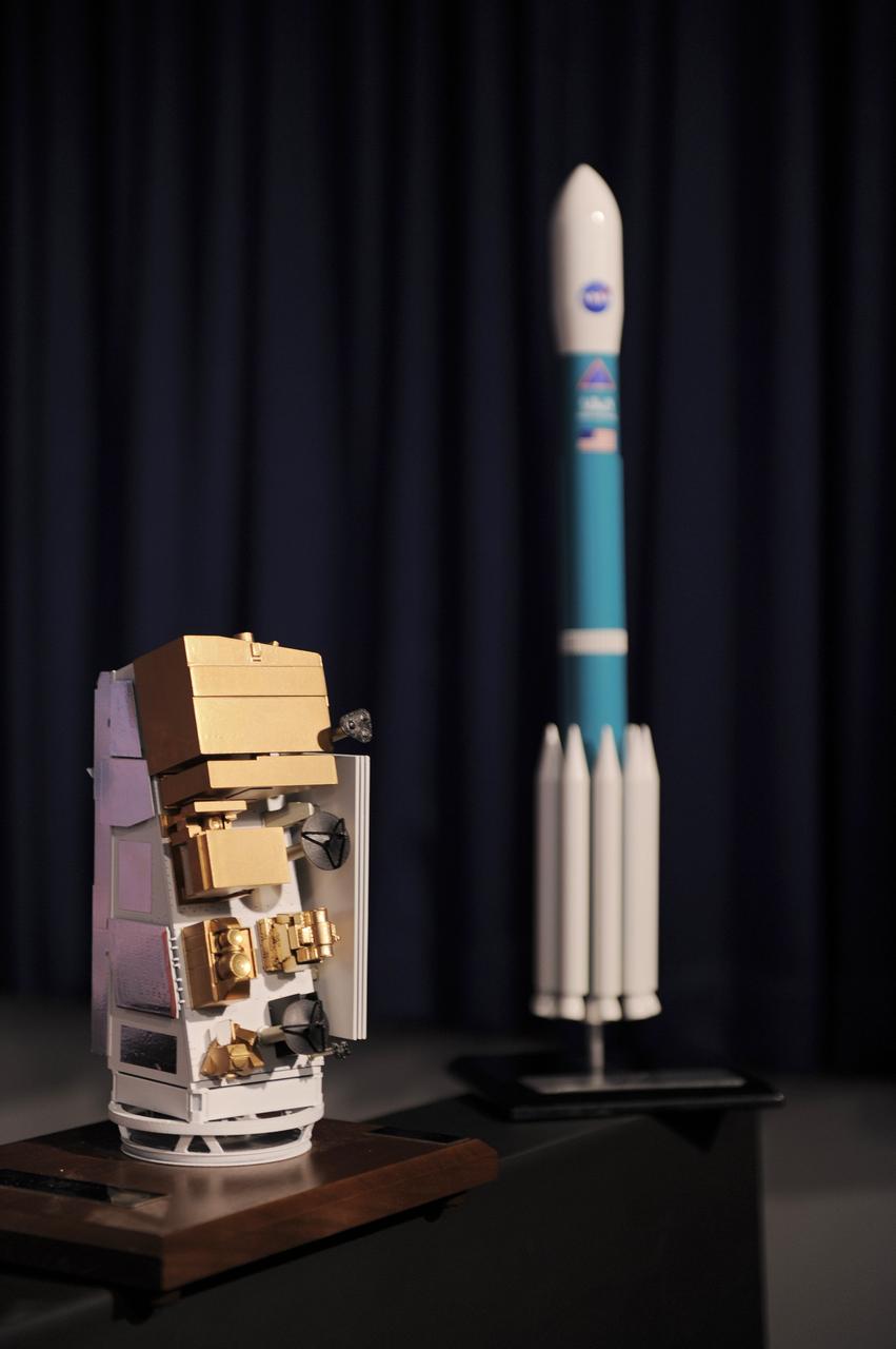 VANDENBERG AIR FORCE BASE, Calif. -- A model of the NASA’s National Polar-orbiting Operational Environmental Satellite System Preparatory Project (NPP) spacecraft and the United Launch Alliance Delta II rocket are displayed during the prelaunch news conference at Vandenberg Air Force Base, Calif. NPP represents a critical first step in building the next-generation of Earth-observing satellites. NPP will carry the first of the new sensors developed for this satellite fleet, now known as the Joint Polar Satellite System (JPSS), to be launched in 2016. NPP is the bridge between NASA's Earth Observing System (EOS) satellites and the forthcoming series of JPSS satellites. The mission will test key technologies and instruments for the JPSS missions. NPP is targeted to launch Oct. 28 from Space Launch Complex-2 aboard a United Launch Alliance Delta II rocket. For more information, visit http://www.nasa.gov/NPP. Photo credit: NASA/VAFB