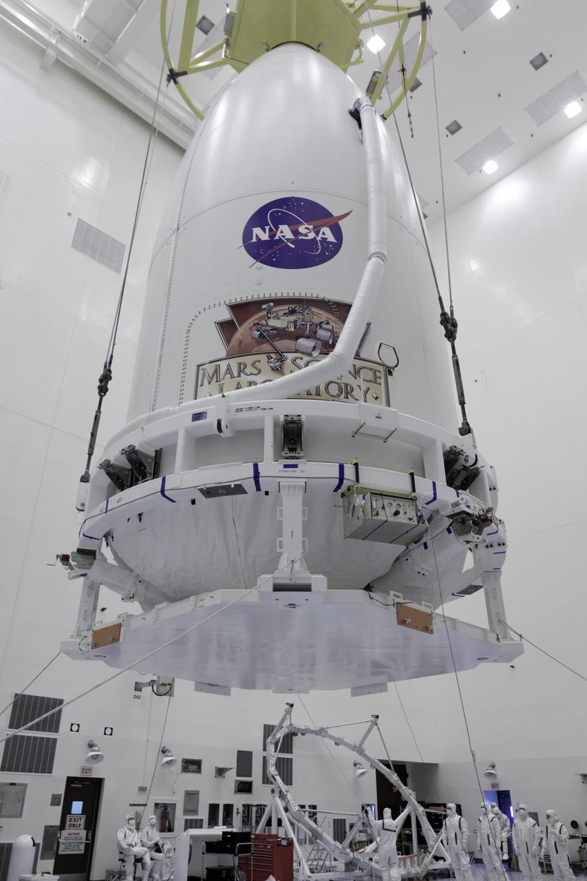 CAPE CANAVERAL, Fla. -- The Atlas V payload fairing containing NASA's Mars Science Laboratory (MSL) spacecraft rises above the floor of the Payload Hazardous Servicing Facility at Kennedy Space Center in Florida. The fairing will be placed on a transporter for the move to Space Launch Complex 41. MSL's components include a compact car-sized rover, Curiosity, which has 10 science instruments designed to search for evidence on whether Mars has had environments favorable to microbial life, including the chemical ingredients for life. The unique rover will use a laser to look inside rocks and release its gasses so that the rover’s spectrometer can analyze and send the data back to Earth. Launch of MSL aboard a United Launch Alliance Atlas V rocket is planned for Nov. 25 from Space Launch Complex-41 on Cape Canaveral Air Force Station. For more information, visit http://www.nasa.gov/msl. Photo credit: NASA/Kim Shiflett