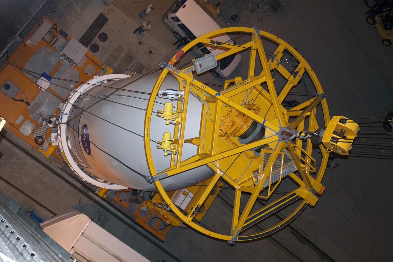 CAPE CANAVERAL, Fla. -- At Space Launch Complex 41 at Cape Canaveral Air Force Station in Florida, a lifting device is attached to the Atlas V payload fairing containing NASA's Mars Science Laboratory (MSL) spacecraft. The fairing, which protects the payload during ascent, will be lifted and mated to the Atlas V rocket already in place at the launch pad. MSL was prepared for launch in the Payload Hazardous Servicing Facility at NASA's Kennedy Space Center. MSL's components include a compact car-sized rover, Curiosity, which has 10 science instruments designed to search for evidence on whether Mars has had environments favorable to microbial life, including the chemical ingredients for life. The unique rover will use a laser to look inside rocks and release its gasses so that the rover’s spectrometer can analyze and send the data back to Earth. Launch of MSL aboard a United Launch Alliance Atlas V rocket is planned for Nov. 25 from Space Launch Complex 41 on Cape Canaveral Air Force Station. For more information, visit http://www.nasa.gov/msl. Photo credit: NASA/Kim Shiflett